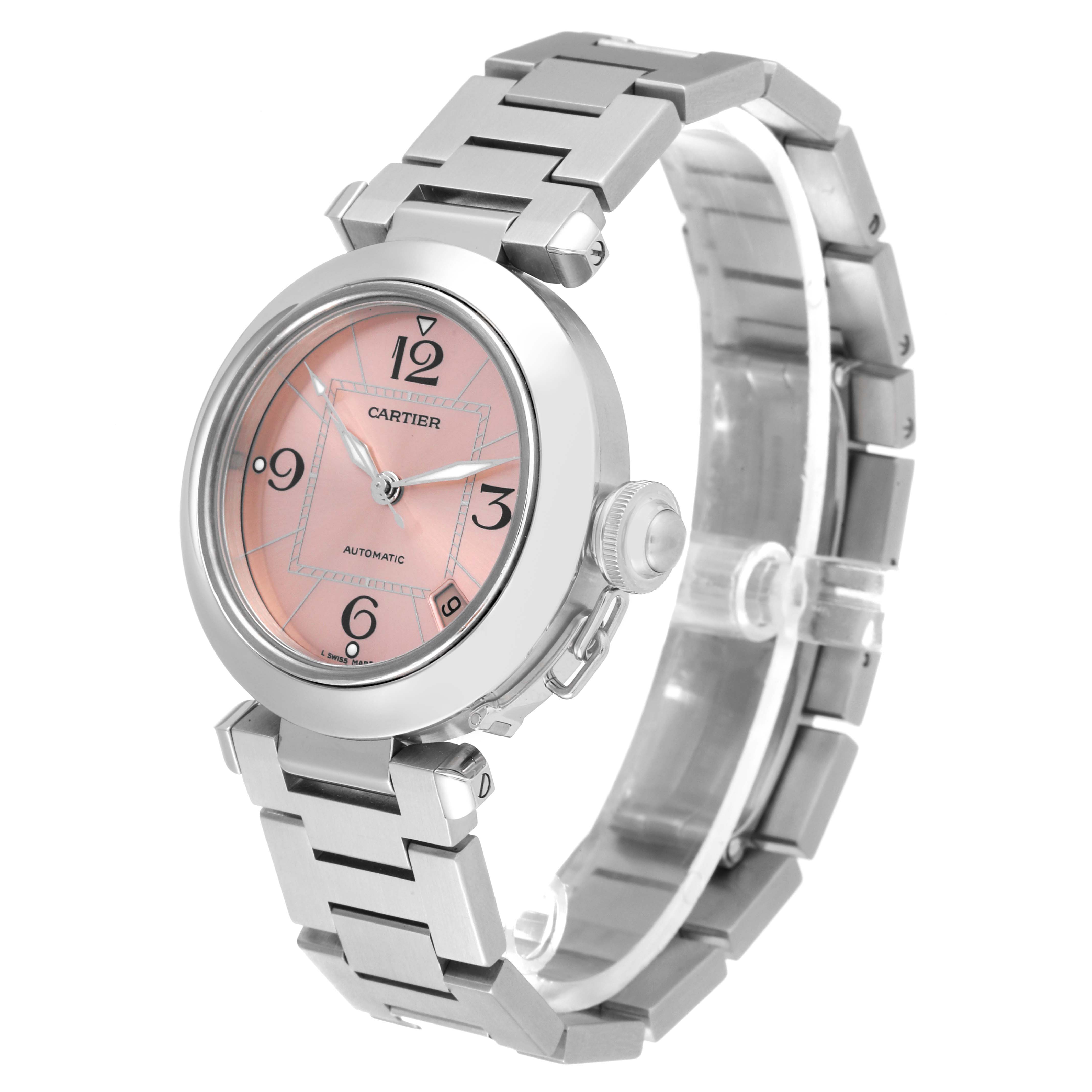 The image shows a Cartier Pasha W31075M7 Women's Stainless Steel Pink Dial W31075M7 Women's Stainless Steel Pink Dial watch at a three-quarter angle, highlighting its pink dial and metal bracelet.