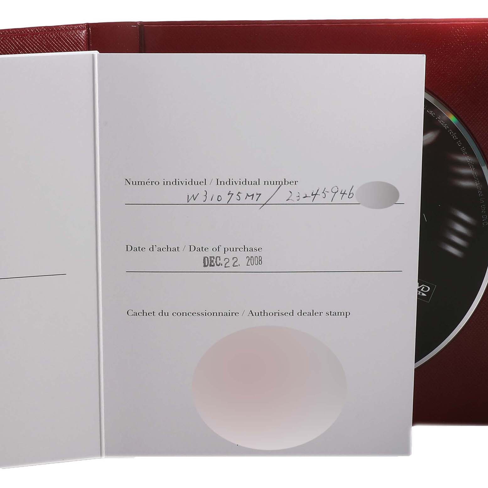 The image shows the certificate of authenticity and warranty card for the Cartier Pasha W31075M7 Women's Stainless Steel Pink Dial W31075M7 Women's Stainless Steel Pink Dial watch, partially covering the product disc and red case.