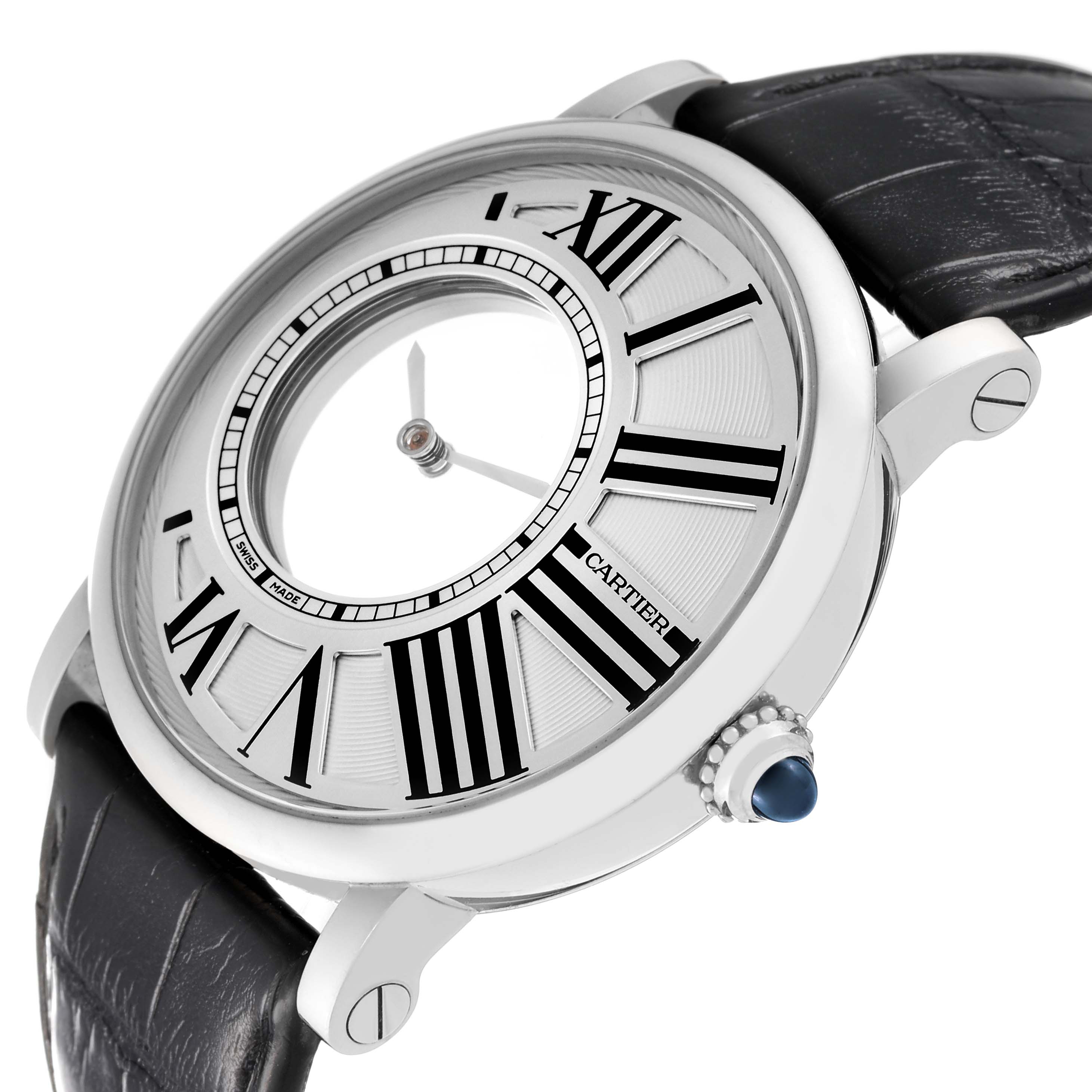 The image shows a side angle of the Rotonde de Cartier watch, focusing on its face, Roman numerals, and the crown with a blue cabochon.