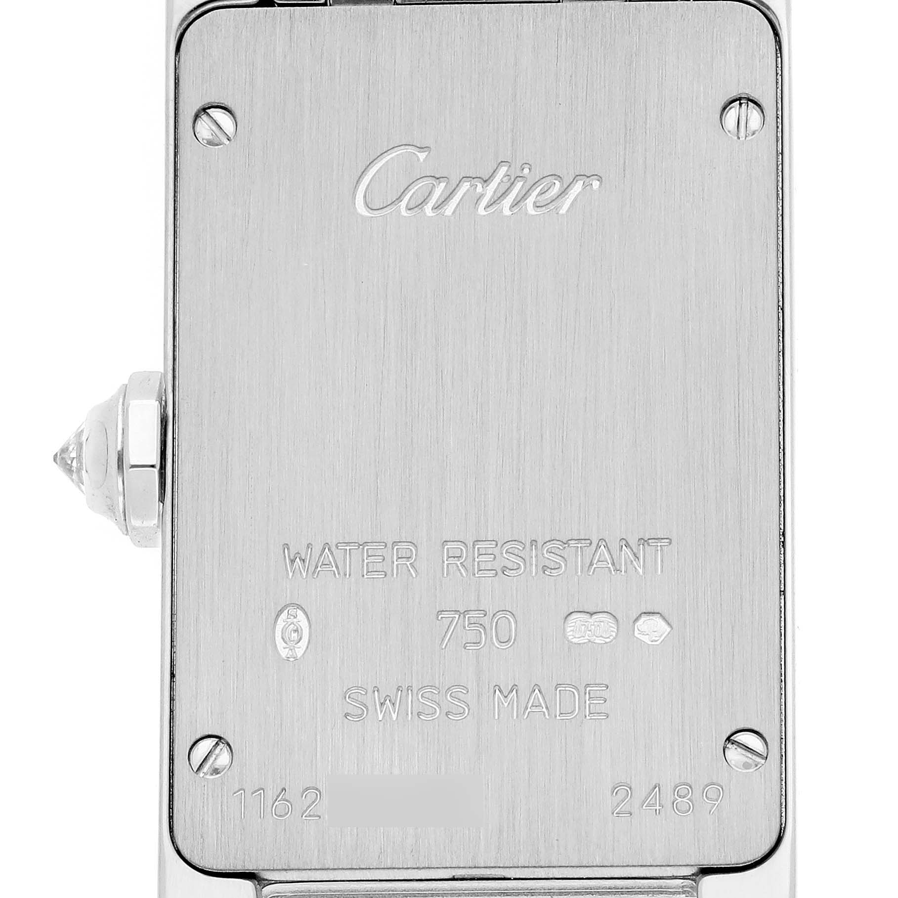 This is the reverse view of a Cartier Tank Americaine WB7073L1 Women's Stainless Steel Silver Dial WB7073L1 Women's Stainless Steel Silver Dial watch showing its back case and inscriptions.