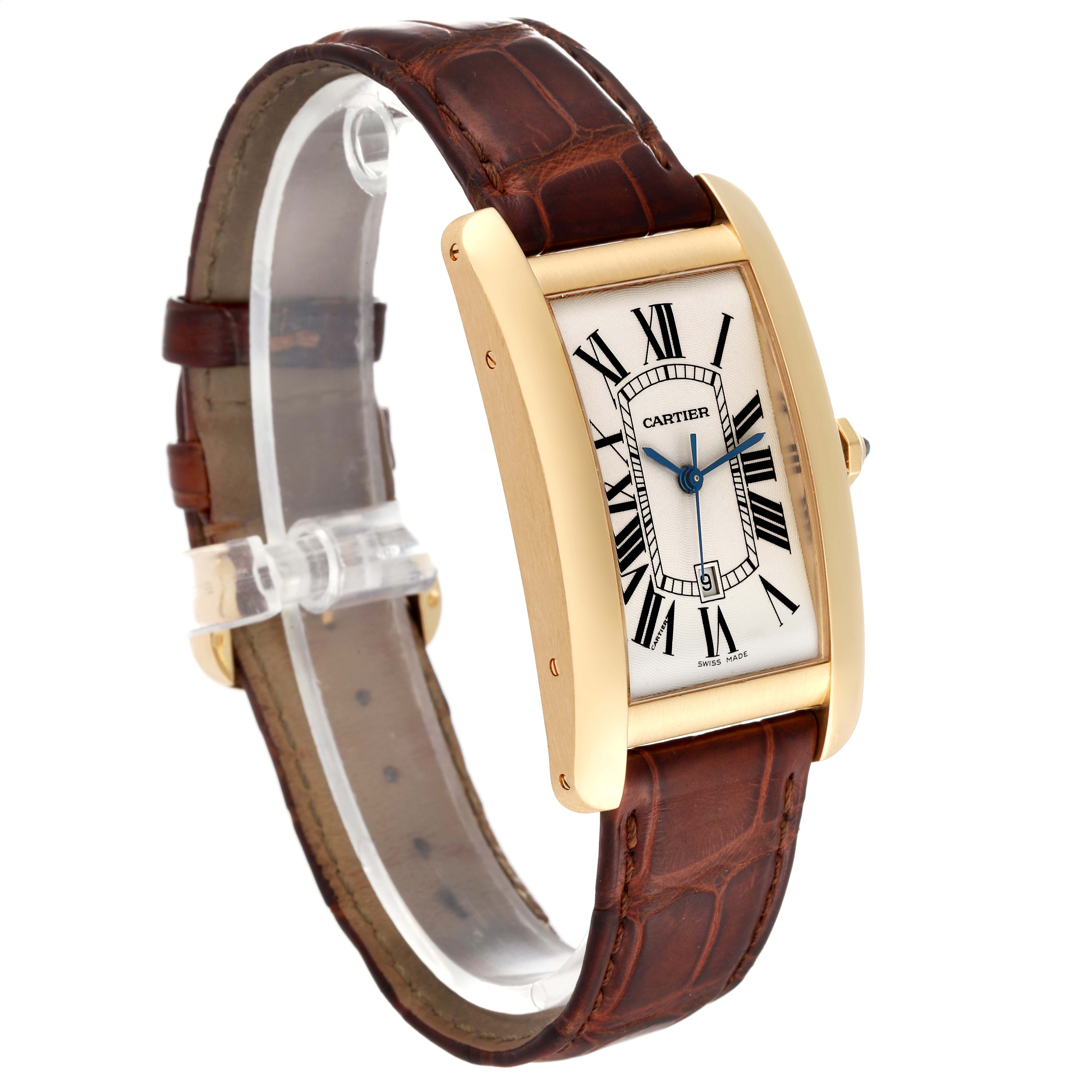 The image shows a Cartier Tank Americaine W2603156 Men
s Yellow Gold Silver Dial W2603156 Men
s Yellow Gold Silver Dial watch angled slightly to the left, highlighting its face and brown leather strap.