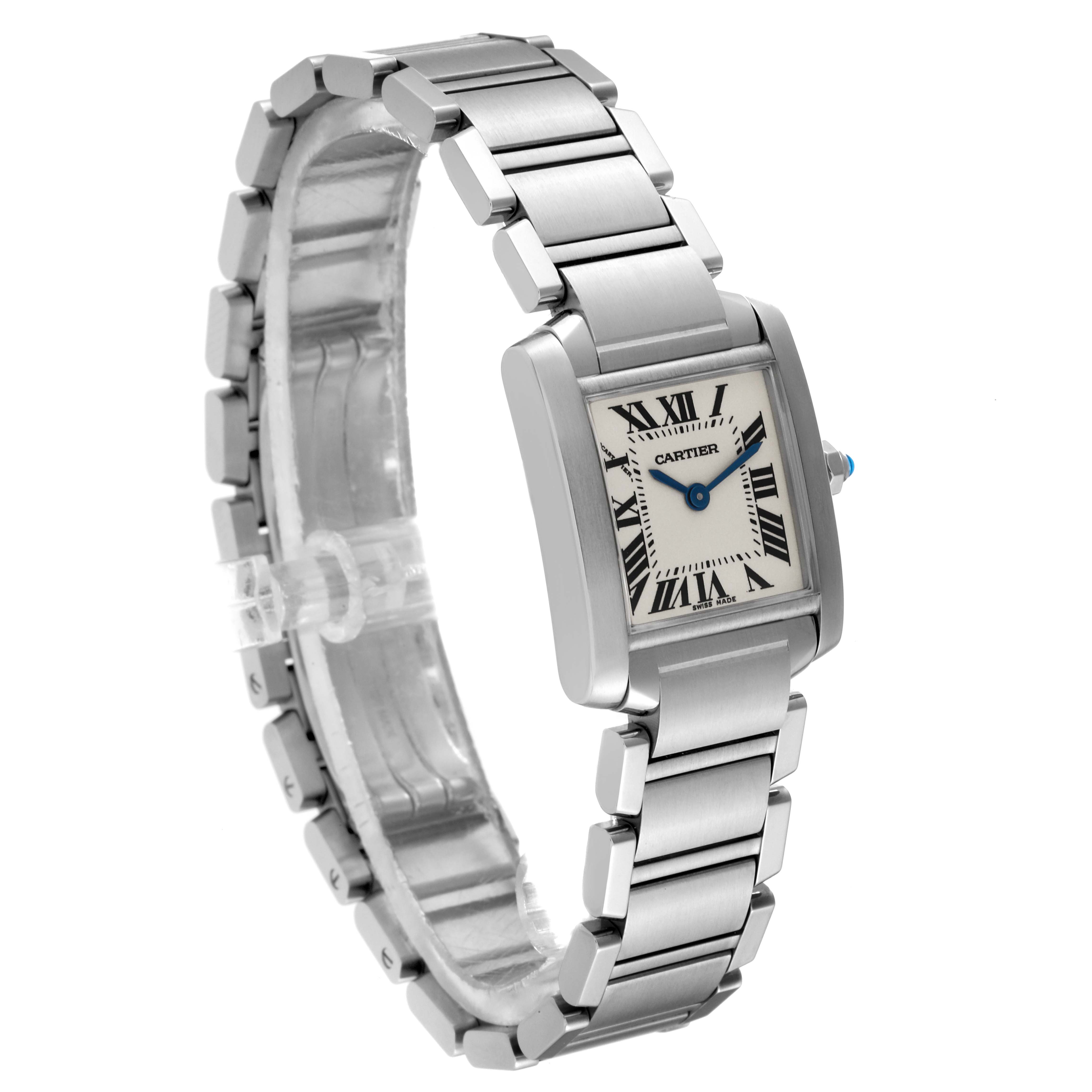 The Cartier Tank Française watch is shown at a three-quarter angle, displaying the stainless steel bracelet and Roman numeral dial.
