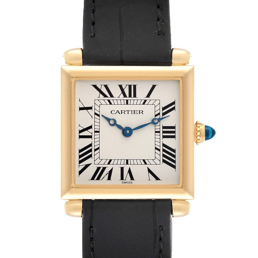 The Cartier Tank Obus W1512256 watch is shown from a front angle, highlighting its square face, Roman numerals, gold bezel, and black leather strap.
