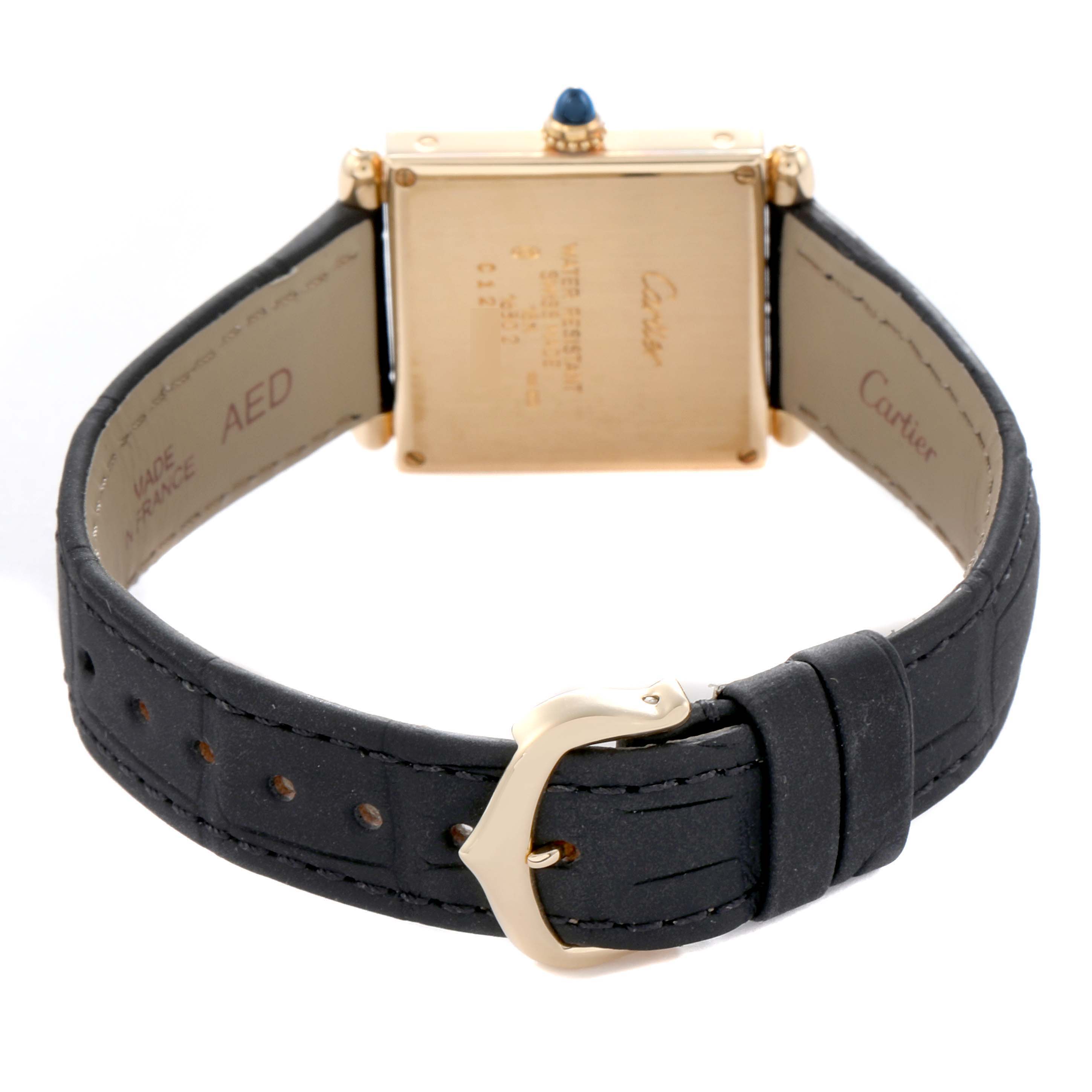 The image shows the back view of a Cartier Tank Obus W1512256 Women
s Yellow Gold Silver Dial watch, highlighting the case back, strap, and buckle.