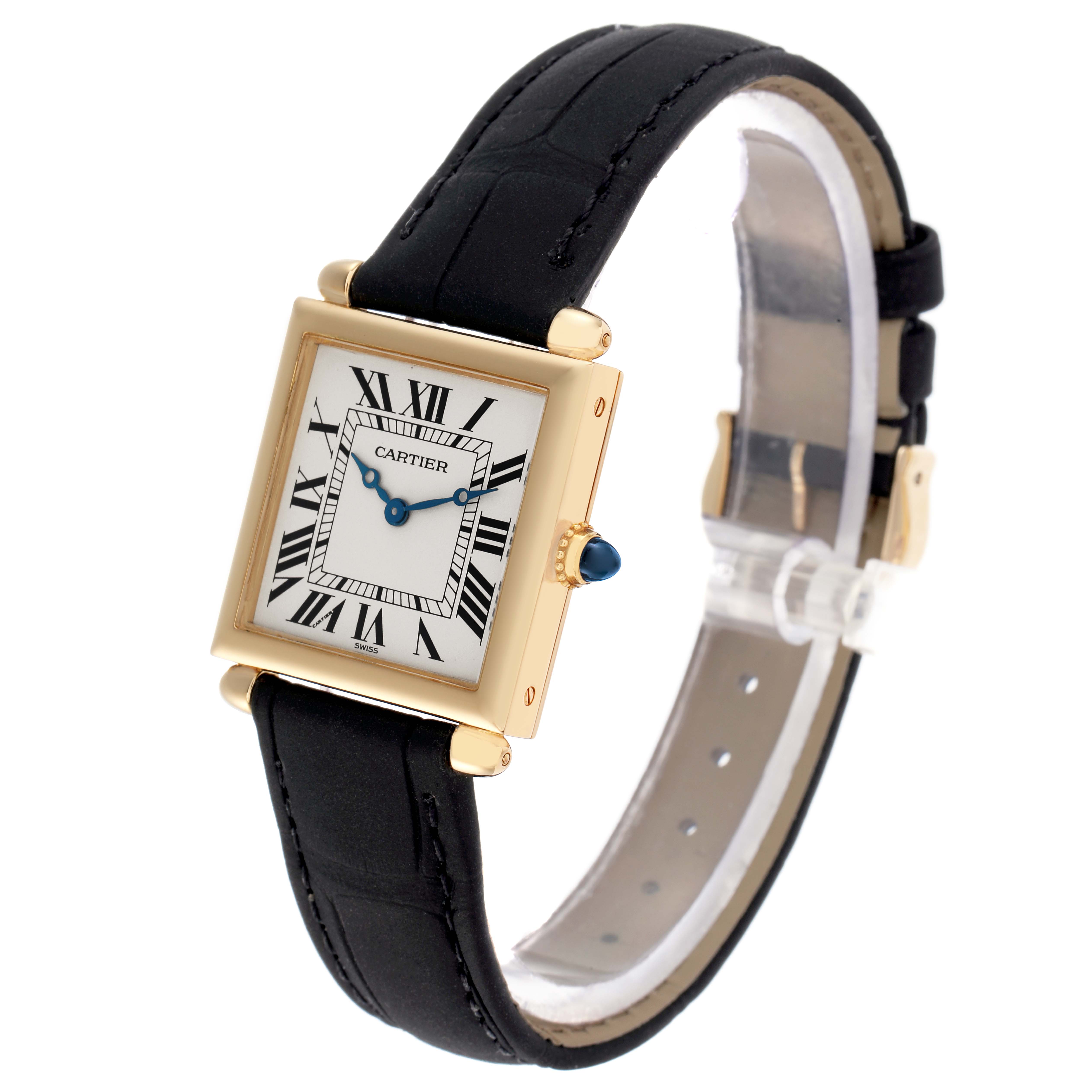 The Cartier Tank Obus W1512256 Women
s Yellow Gold Silver Dial watch is shown at a three-quarter angle, highlighting its gold square case, black leather strap, and white Roman numeral dial.
