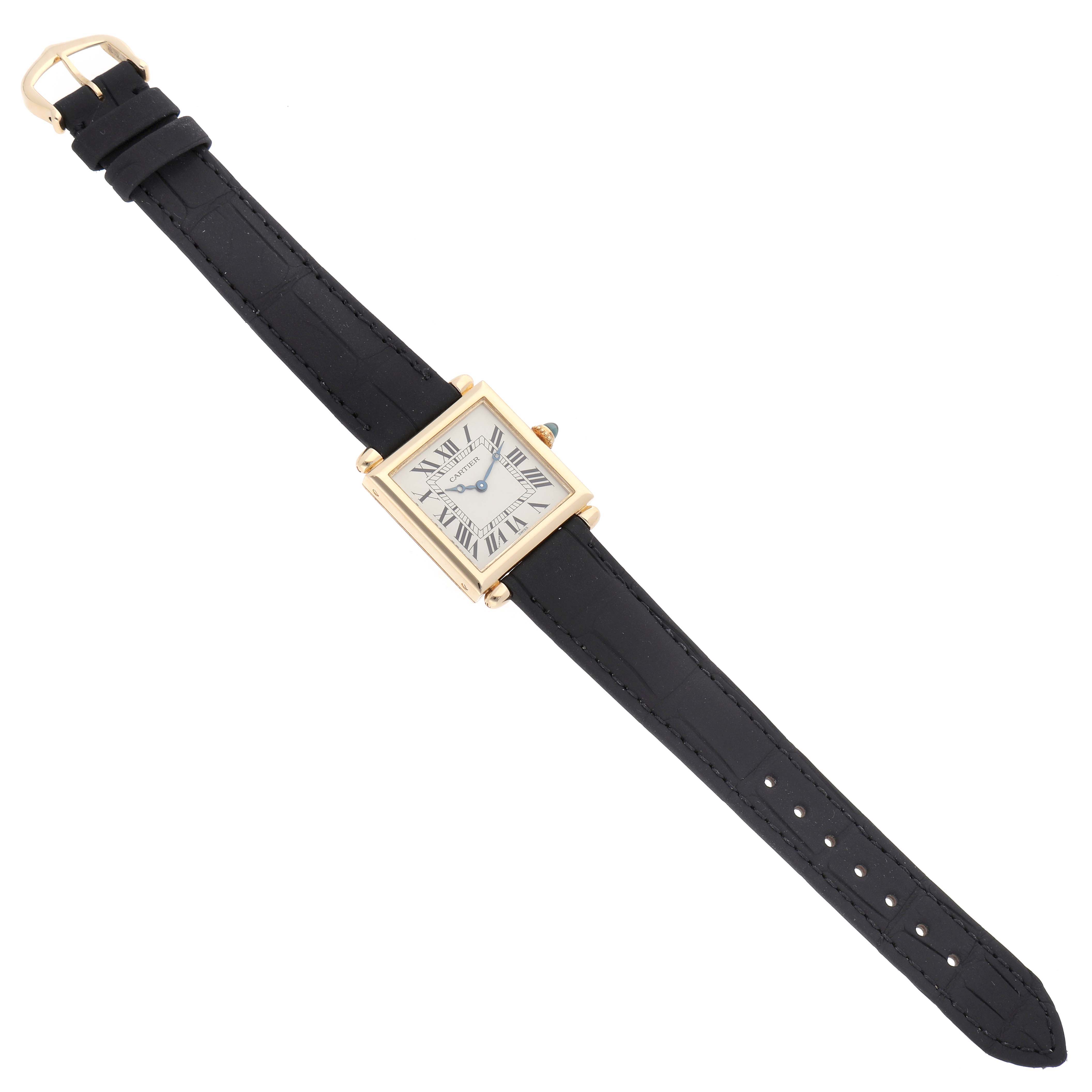 The Cartier Tank Obus W1512256 Women
s Yellow Gold Silver Dial watch is shown from a top-down angle, displaying its face, case, and full leather strap.