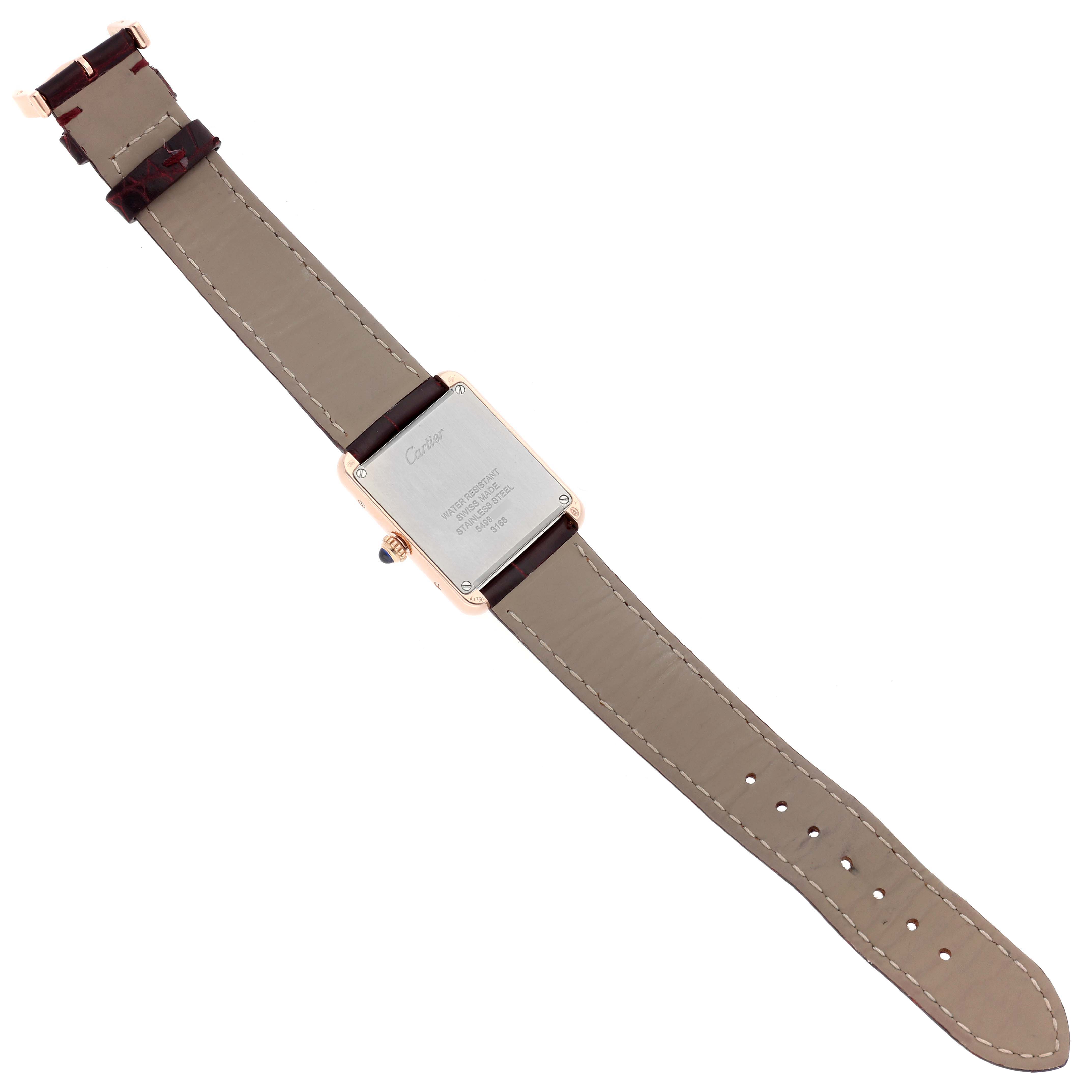 The Cartier Tank Solo W5200024 Women
s Rose Gold Silver Dial watch is shown from the back, displaying its case and leather strap.