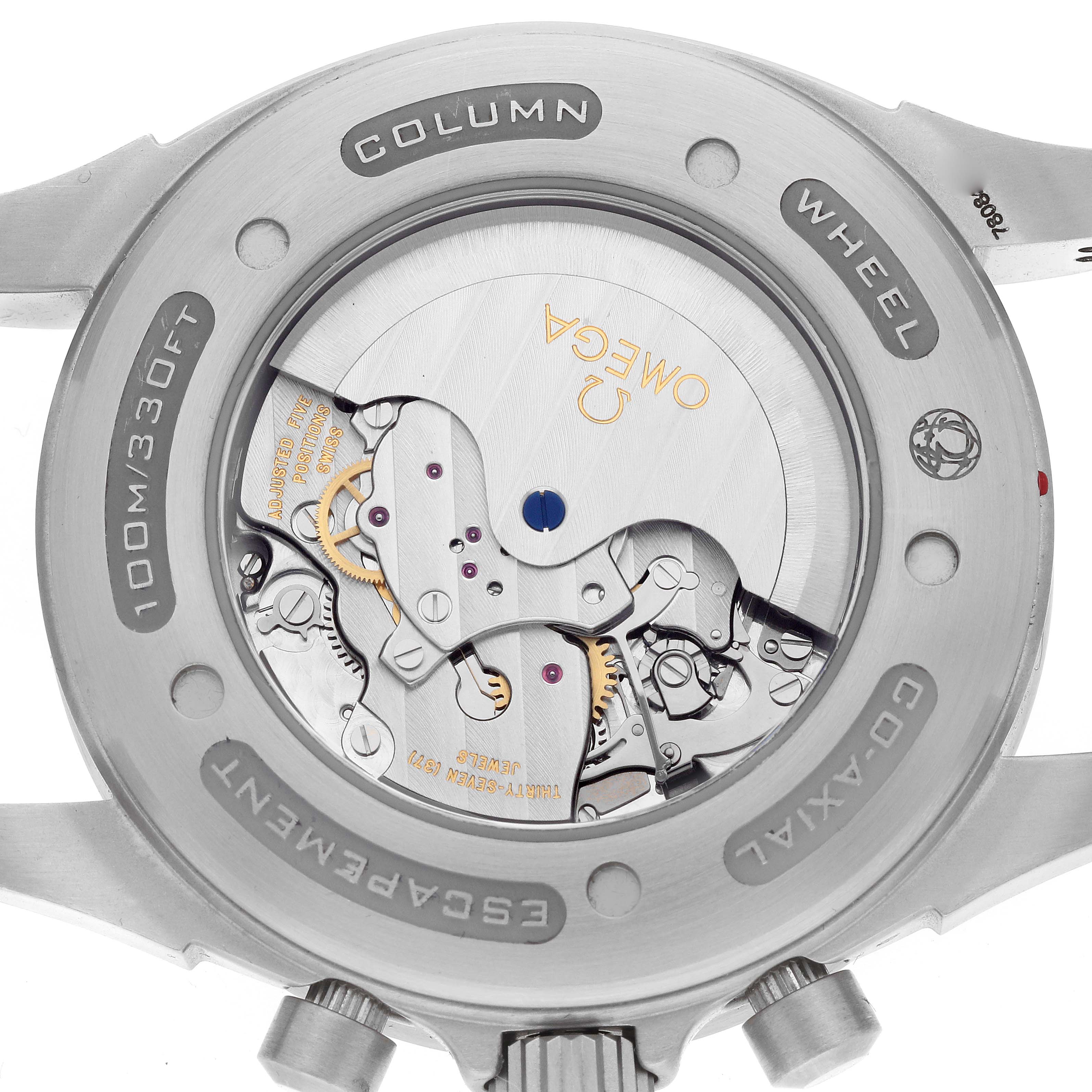 The image shows the back view of an Omega De Ville 422.13.44.52.13.001 Men's Stainless Steel Brown Dial watch, highlighting its exposed movement and "Co-Axial" escapement.