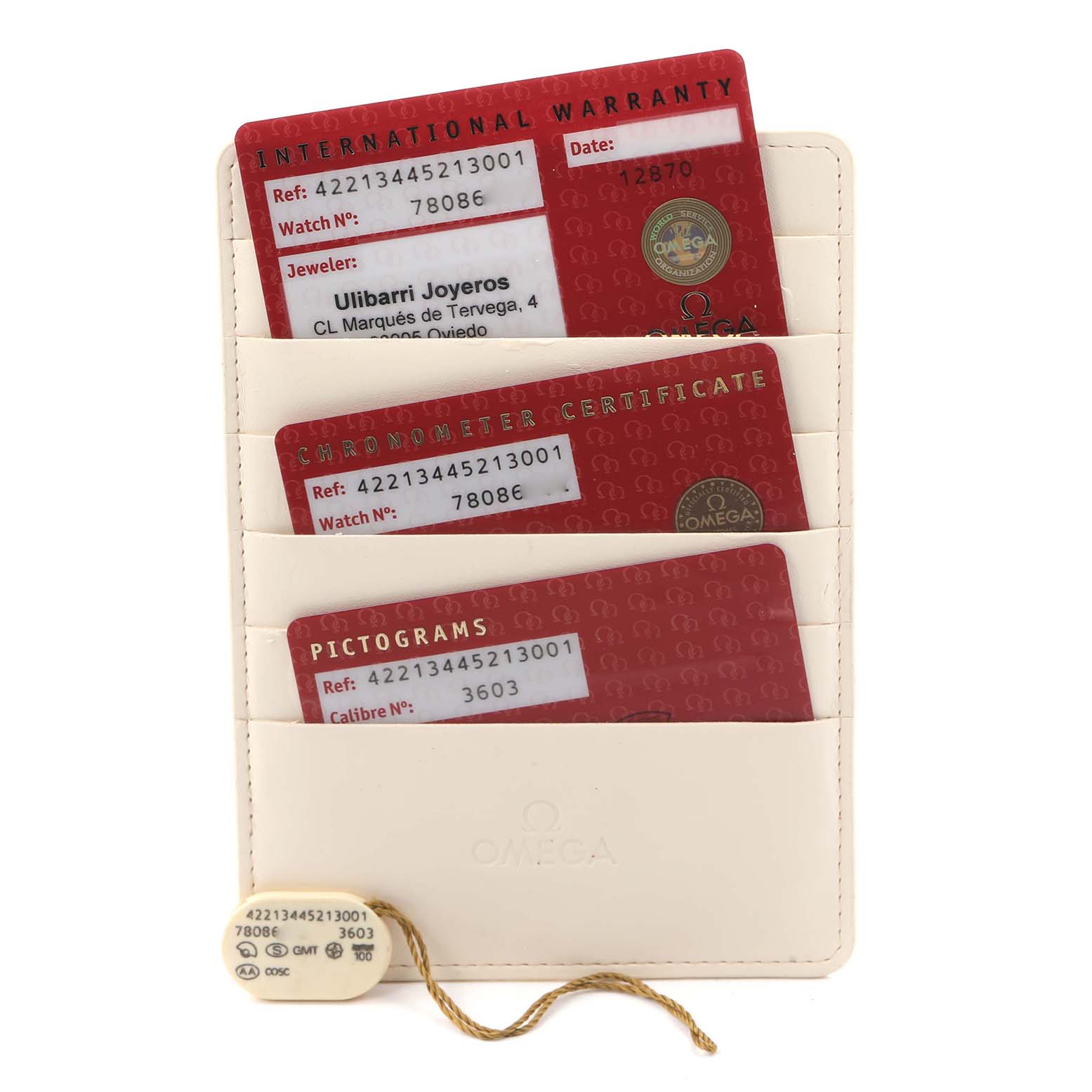 The image shows Omega De Ville 422.13.44.52.13.001 Men's Stainless Steel Brown Dial's warranty, chronometer certificate, picogram cards, and a tag on a flat folder.