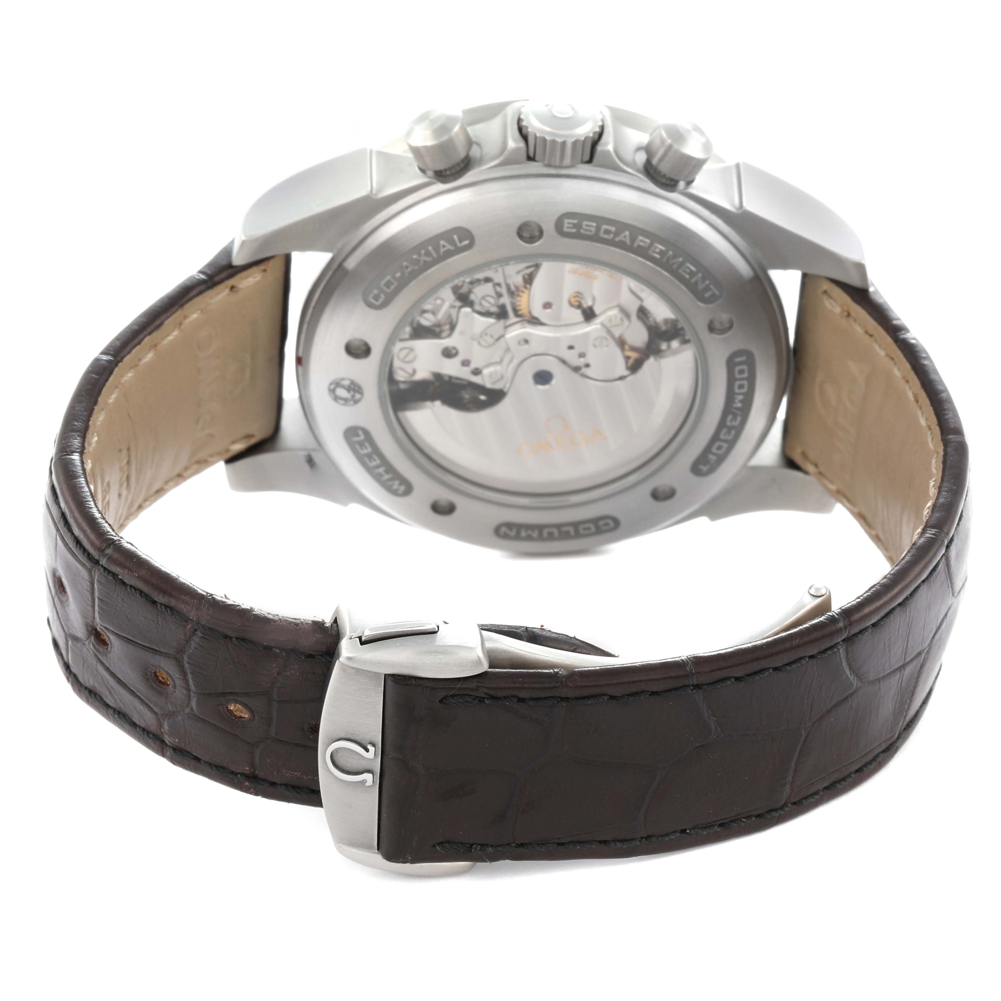 The Omega De Ville 422.13.44.52.13.001 Men's Stainless Steel Brown Dial watch is shown from the back angle, highlighting its transparent case back and leather strap.