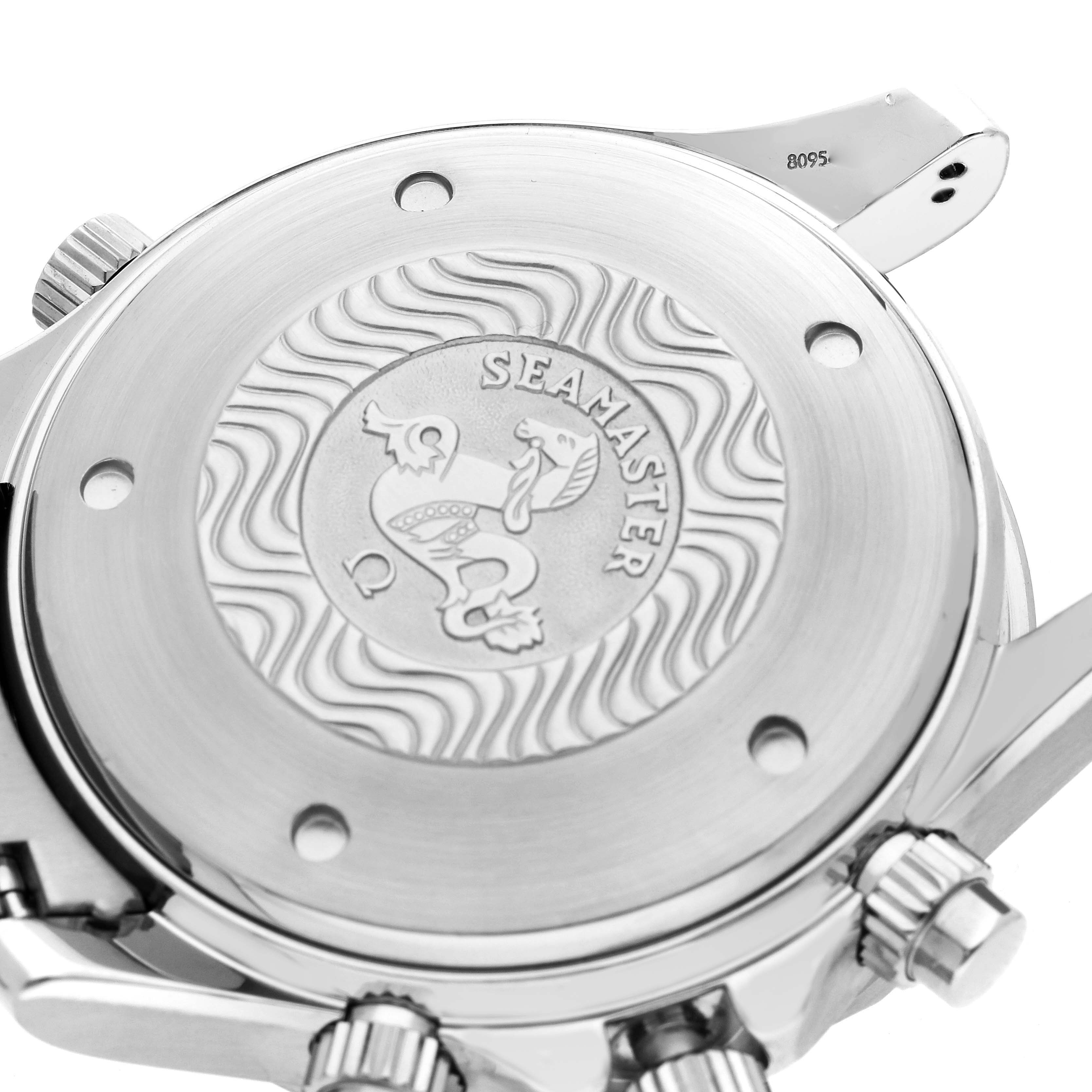 The image shows the back case of the Omega Seamaster 2599.80.00 Men
s Stainless Steel Blue Dial watch, highlighting the engraved logo and surrounding screws from an angled view.