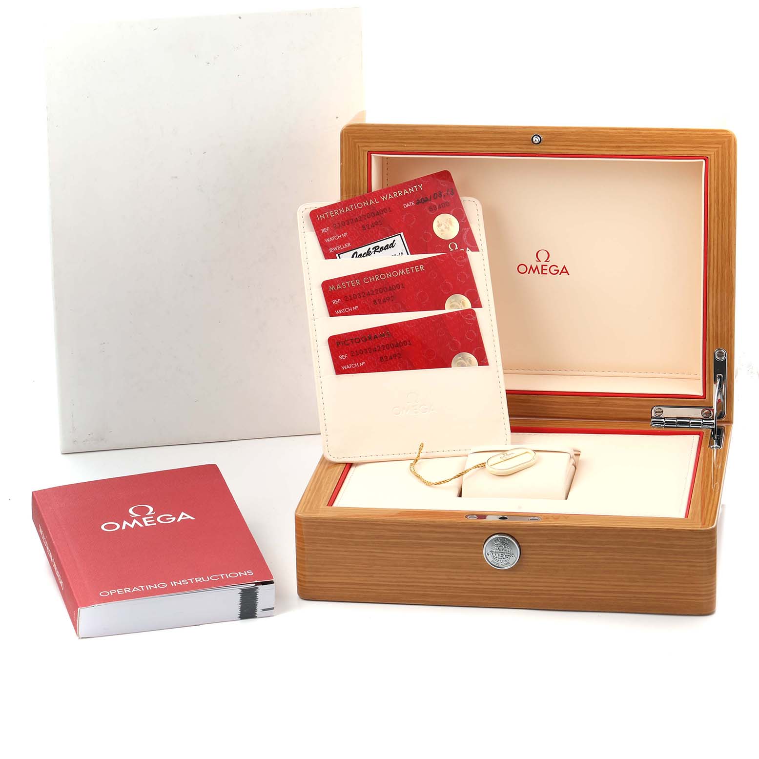 The image shows an Omega Seamaster 210.32.42.20.04.001 Men
s Stainless Steel White Dial watch box with its accessories, including warranty cards and an instruction manual.