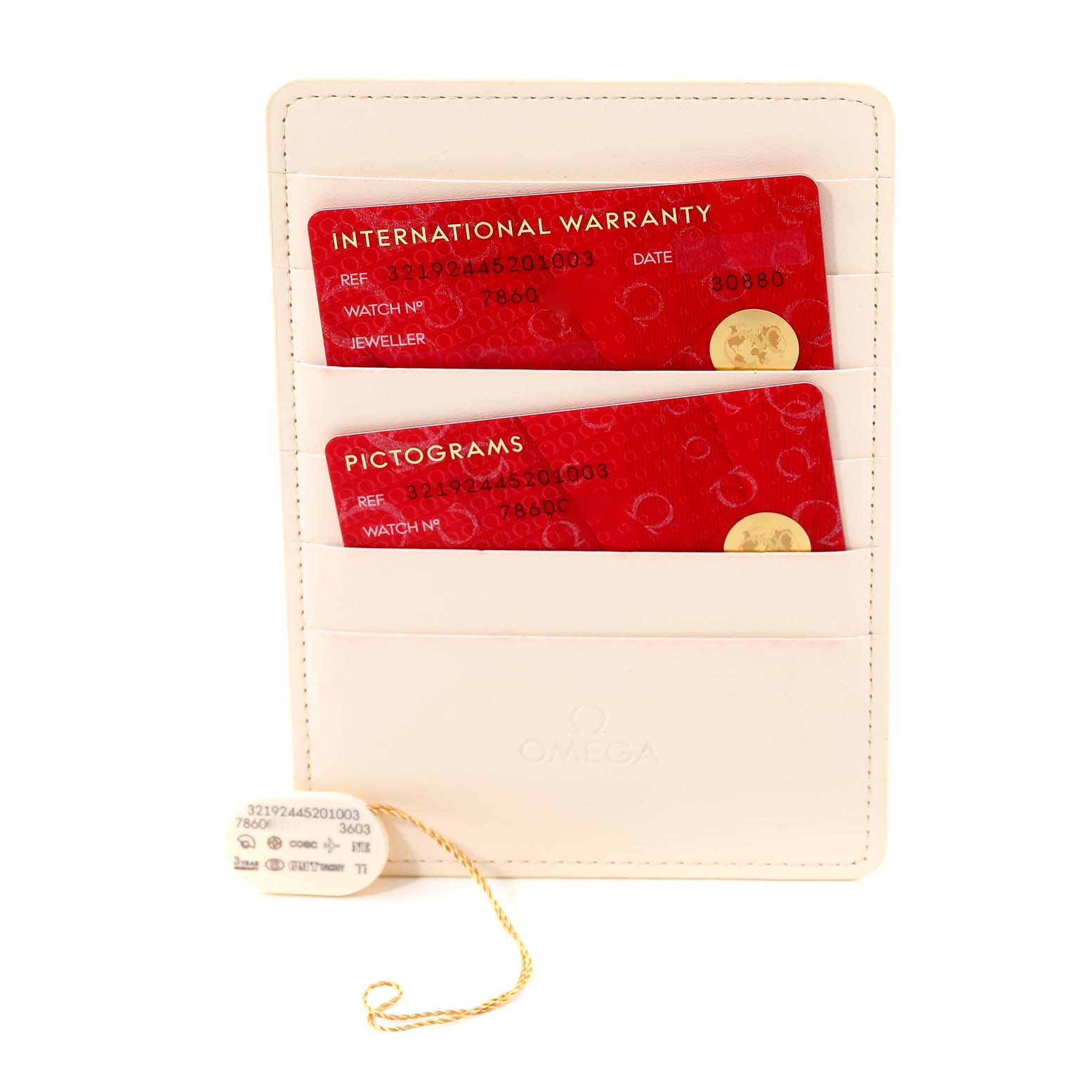 The image shows the internationally certified warranty cards and tags for the Omega Speedmaster 321.92.44.52.01.003 Men's Titanium Black Dial 321.92.44.52.01.003 Men's Titanium Black Dial watch, presented in a cream card holder.