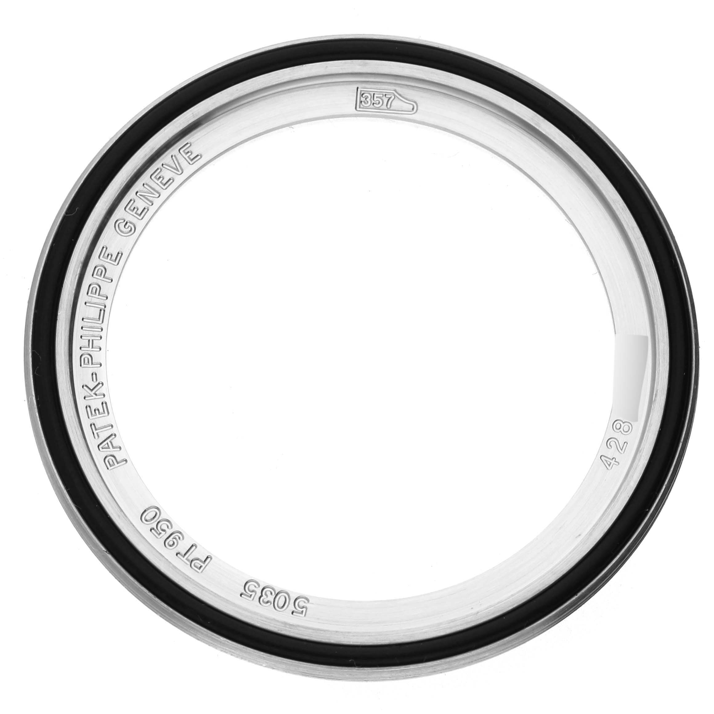 The image shows a bezel part of the Patek Philippe Complications 5035P-026 Men's Platinum Silver Dial 5035P-026 Men's Platinum Silver Dial watch, viewed directly from above.