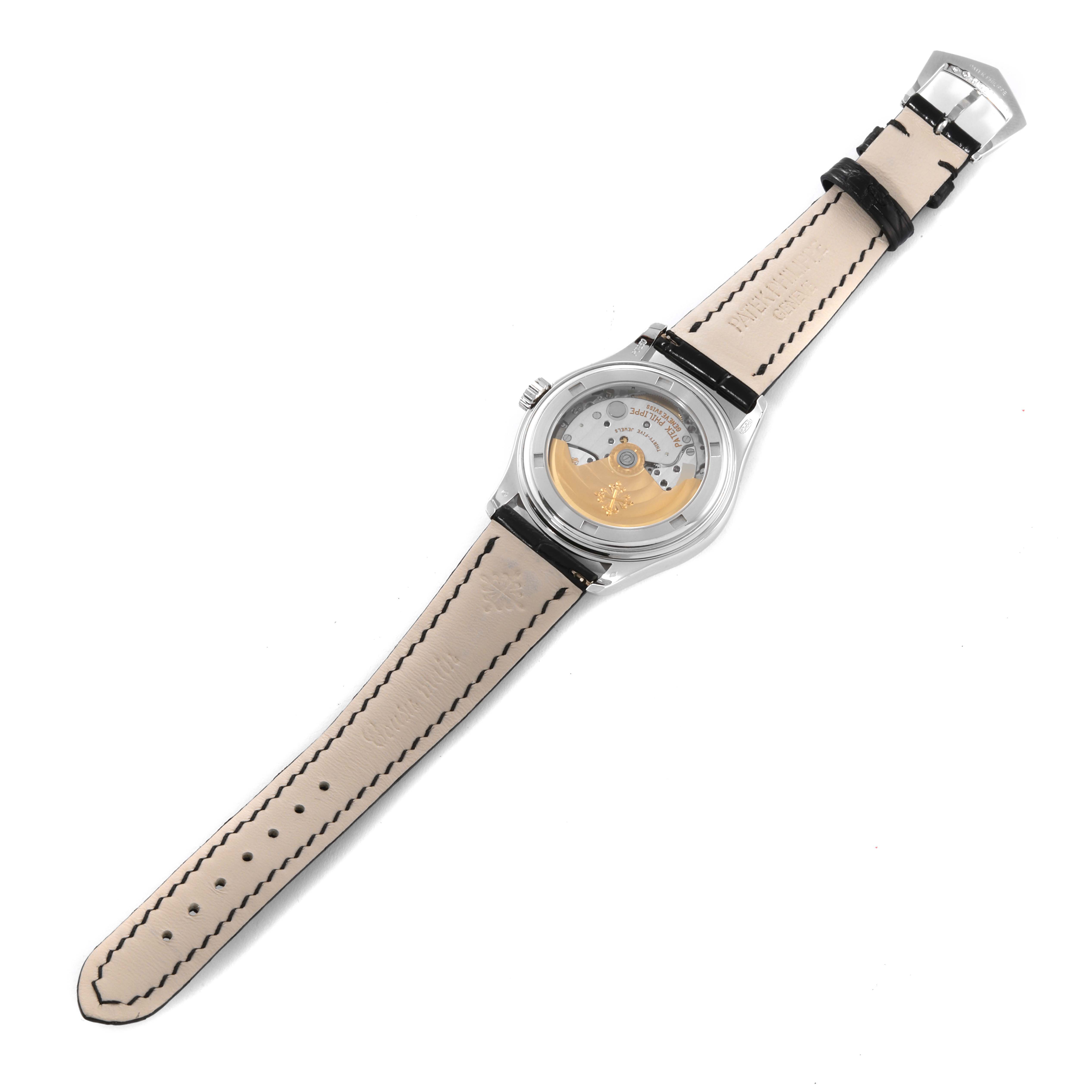 This image shows the back view of a Patek Philippe Complications 5035P-026 Men's Platinum Silver Dial 5035P-026 Men's Platinum Silver Dial model featuring the watch movement and leather strap.