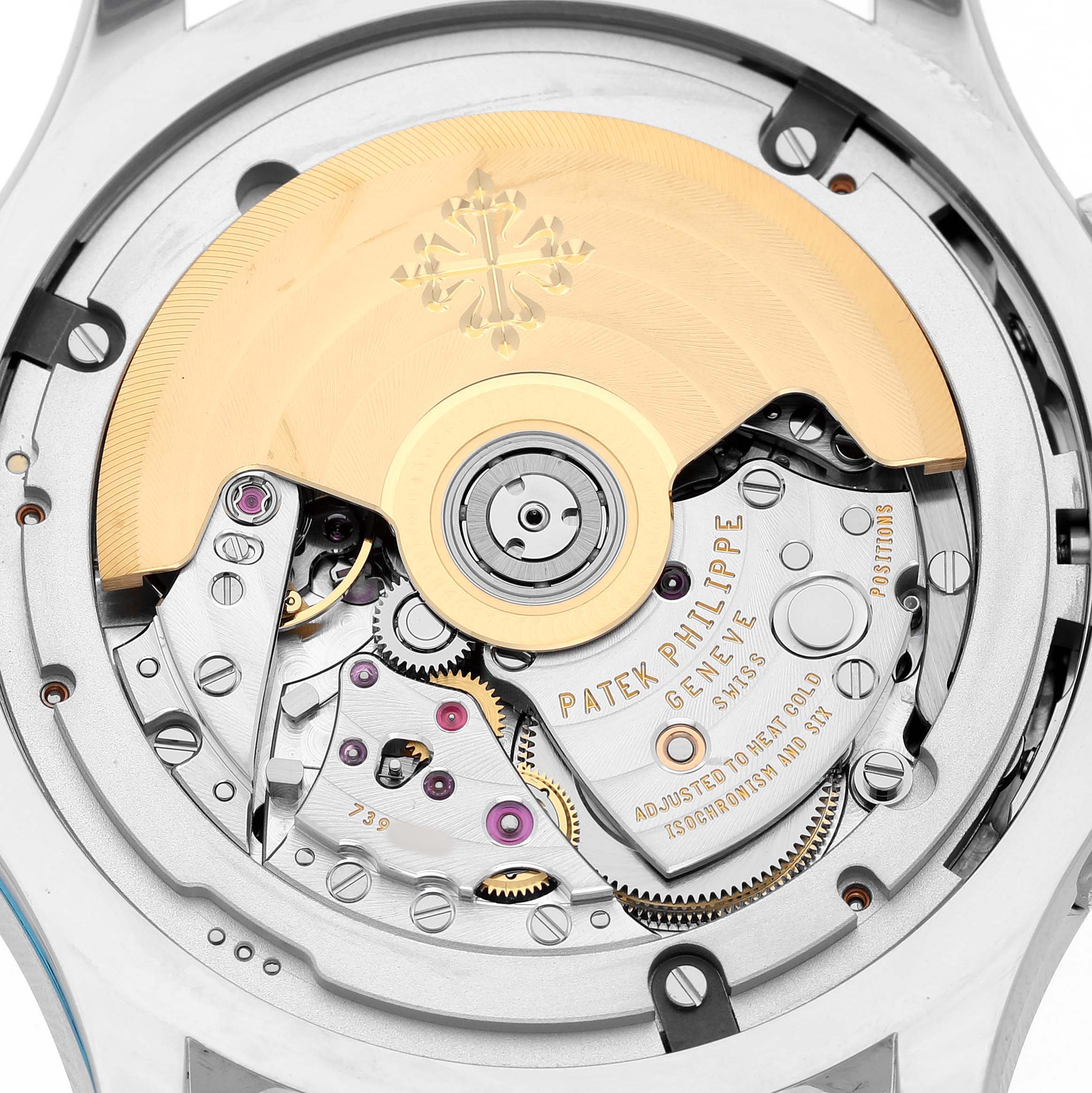 The image shows a close-up of the movement's back of the Patek Philippe Complications 5905/1A-001 Men's Stainless Steel Green Dial watch, highlighting the rotor and intricate gears.