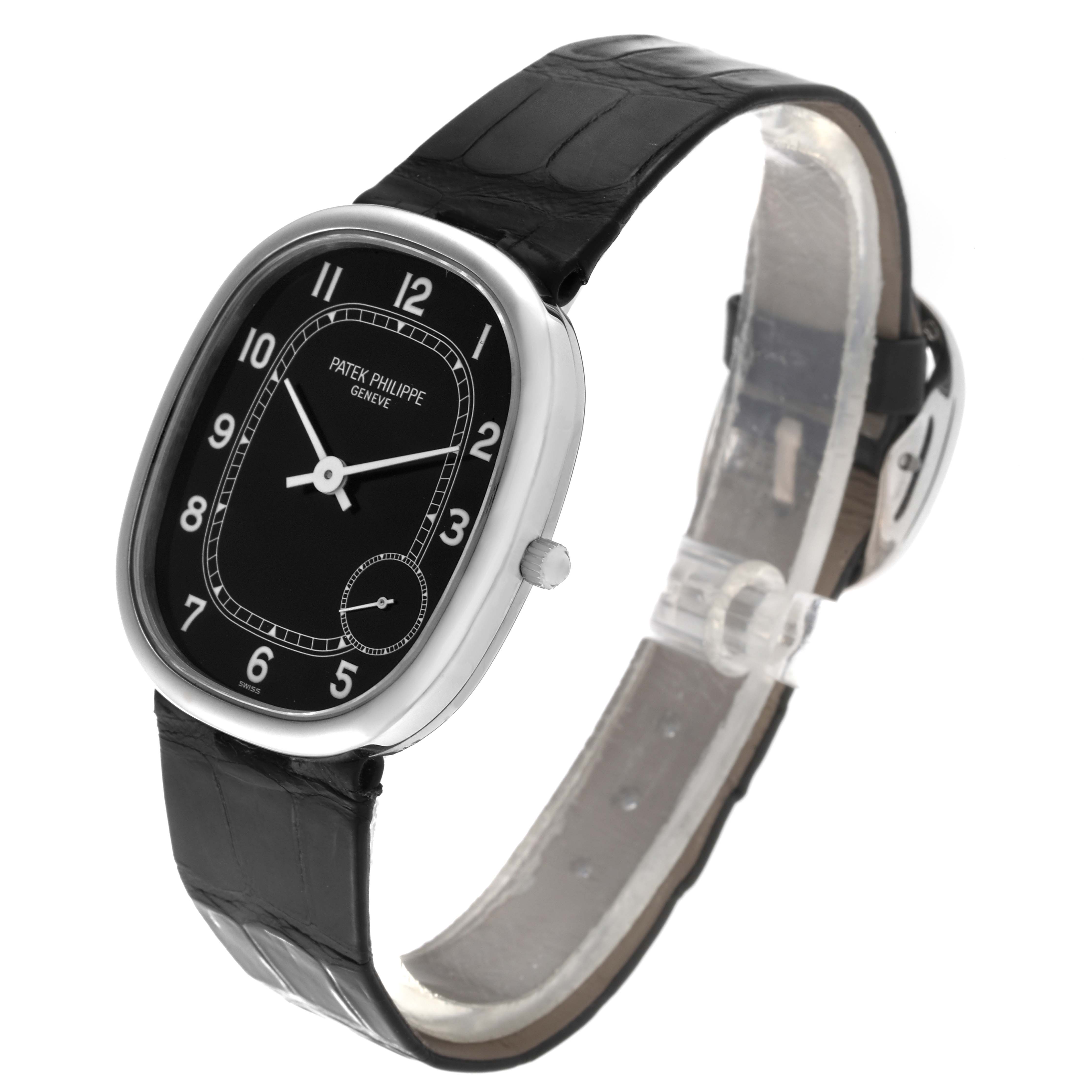 The image shows a Patek Philippe Golden Ellipse 5028G Men's White Gold Black Dial 5028G Men's White Gold Black Dial watch angled to display the face, black strap, and side crown.