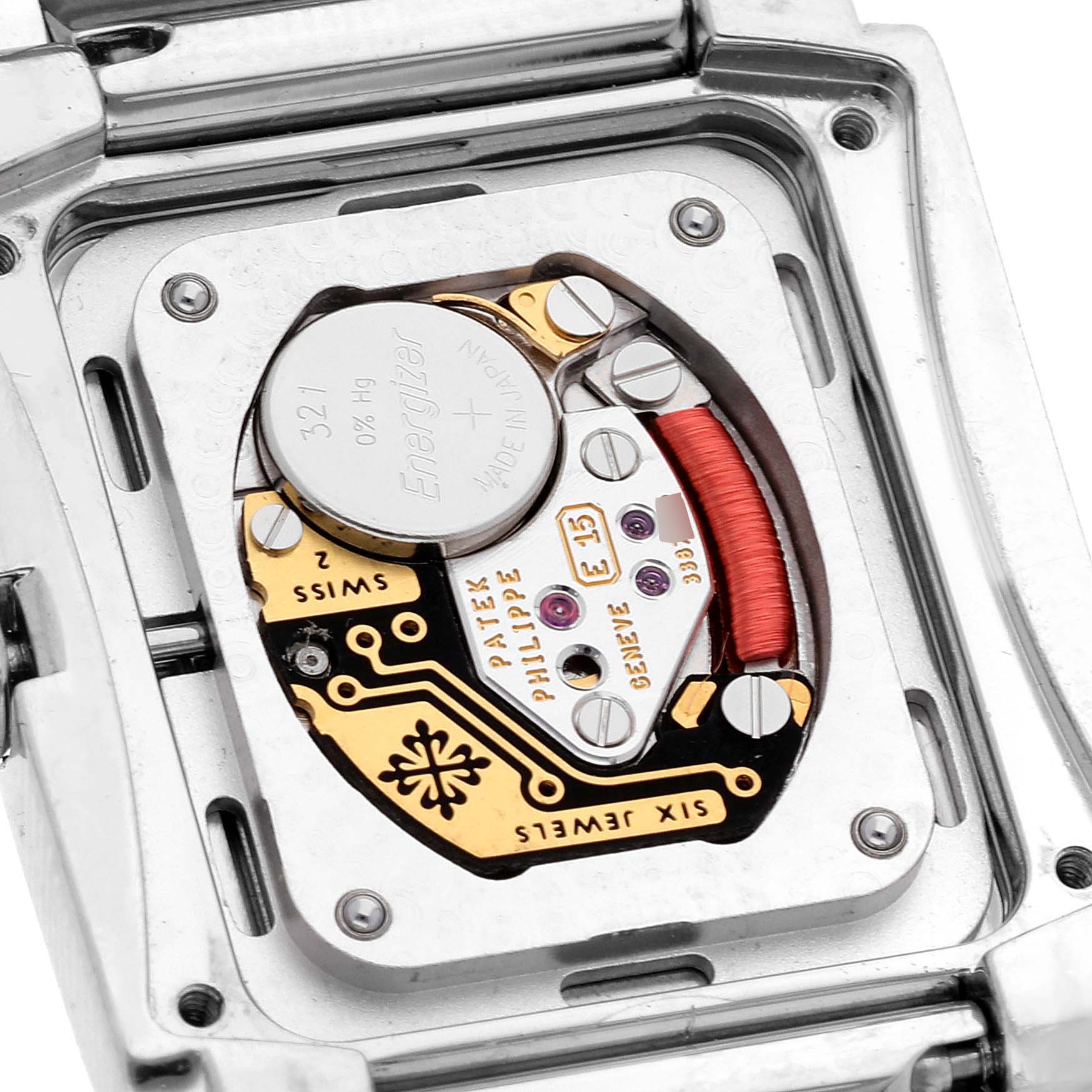 The image shows the back of a Patek Philippe Twenty-4 4910/10 Women
s Stainless Steel Grey Dial 4910/10 Women
s Stainless Steel Grey Dial watch, revealing its internal mechanics and battery.