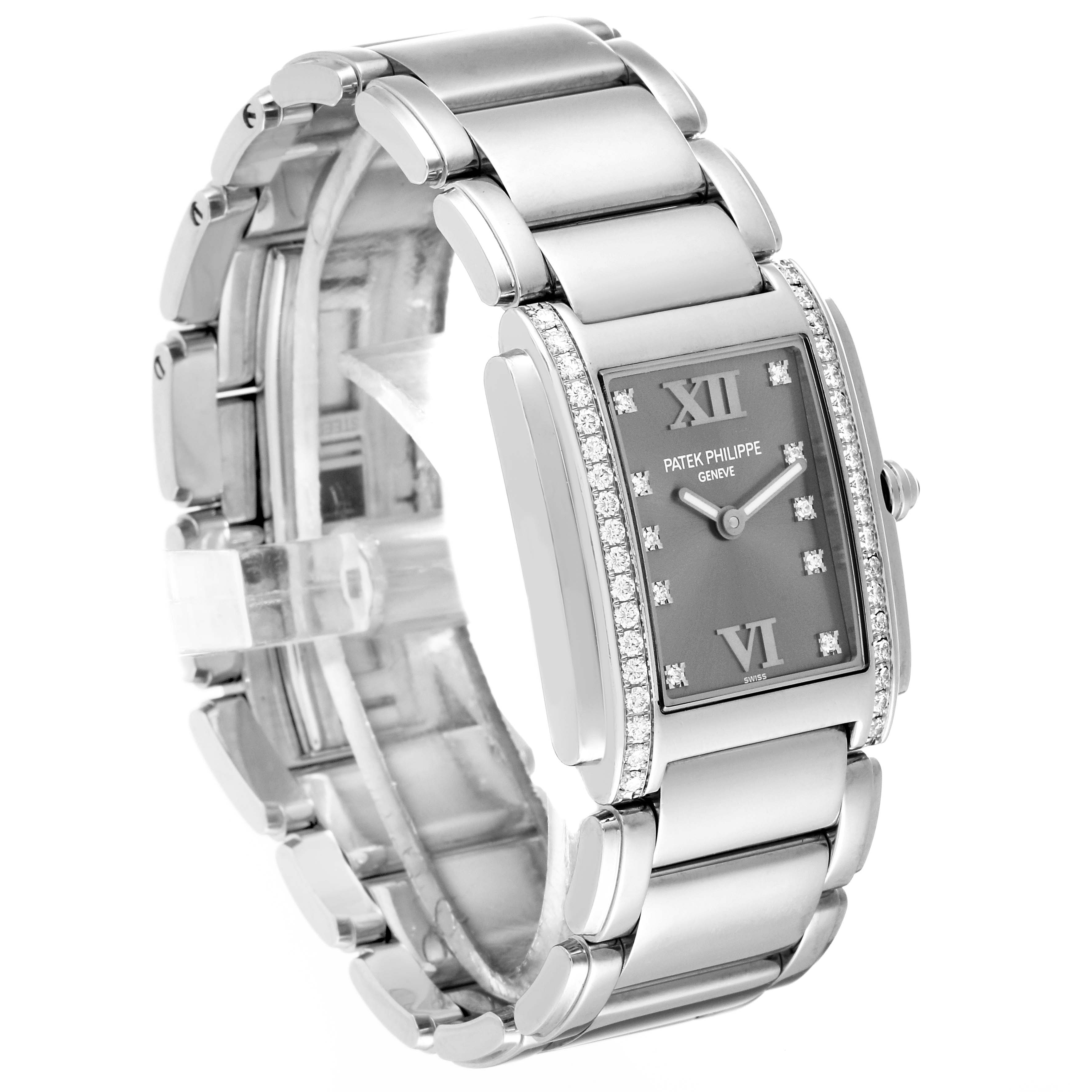 The Patek Philippe Twenty-4 4910/10 Women
s Stainless Steel Grey Dial 4910/10 Women
s Stainless Steel Grey Dial watch is shown at a slight angle, displaying its bracelet, dial, and bejeweled bezel.