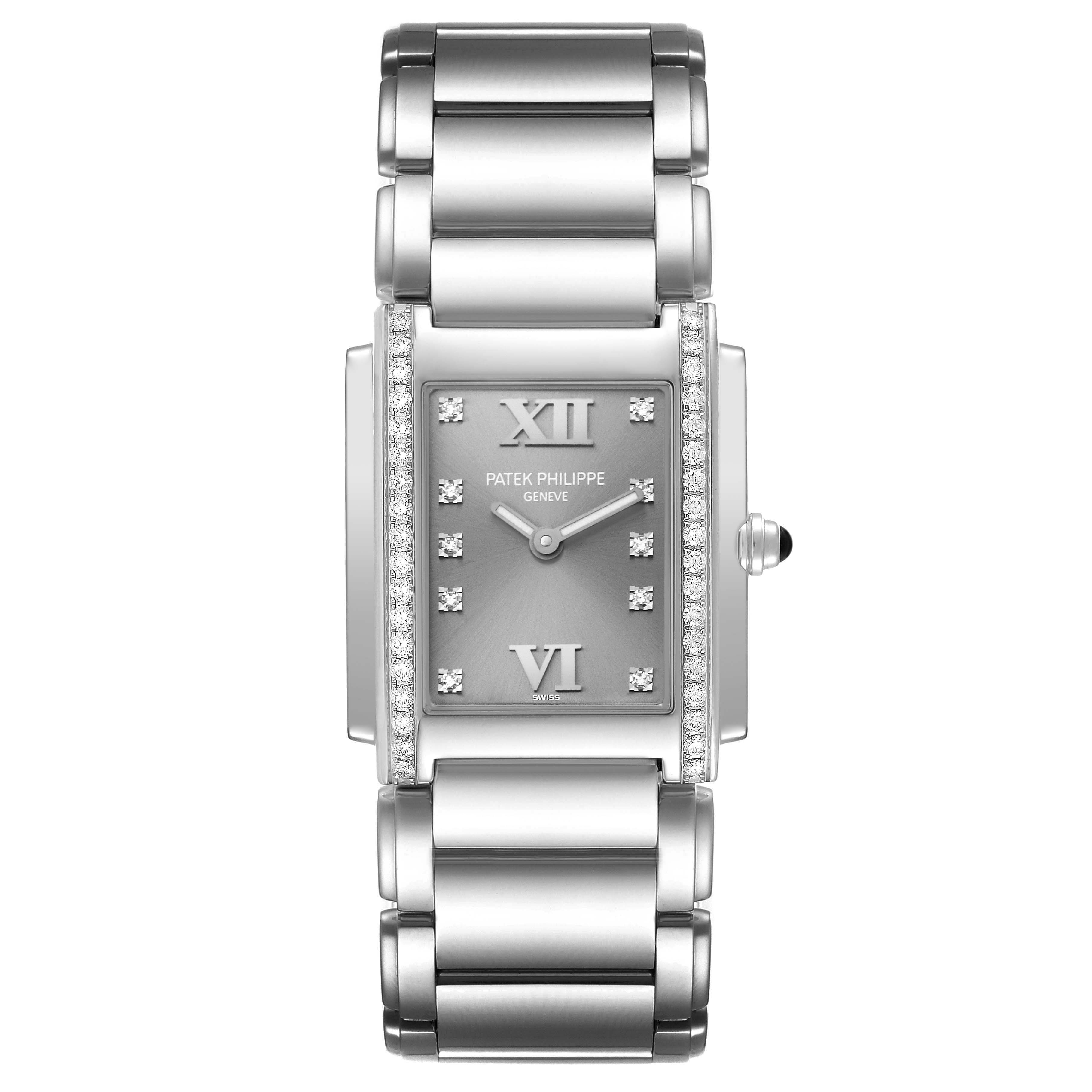The image shows a front view of the Patek Philippe Twenty-4 4910/10 Women
s Stainless Steel Grey Dial 4910/10 Women
s Stainless Steel Grey Dial watch, highlighting its face, bracelet, and diamond-accented bezel.