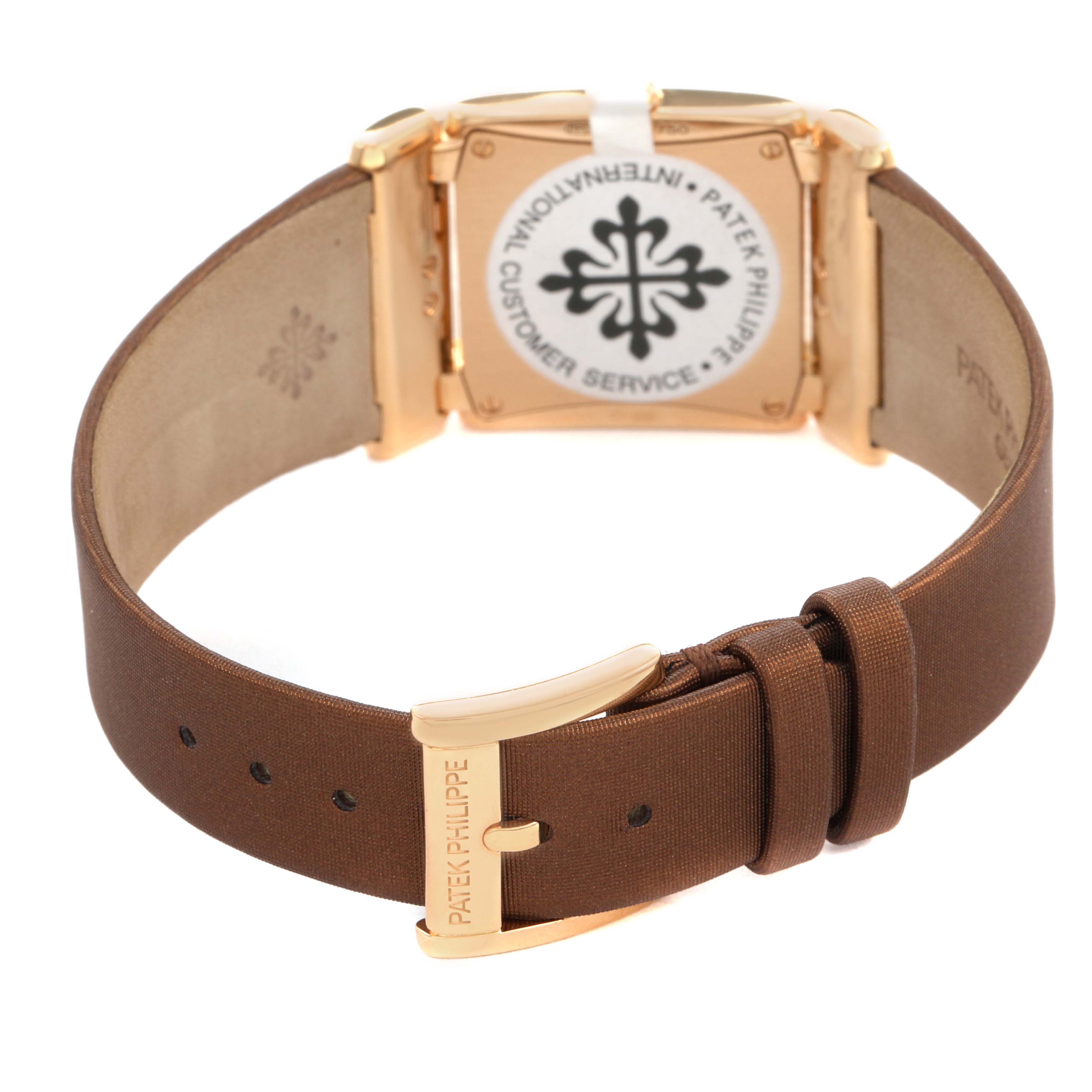 The image shows the back view of a Patek Philippe Twenty-4 4920R-001 Women's Rose Gold Brown Dial watch, highlighting its clasp and inner strap details.