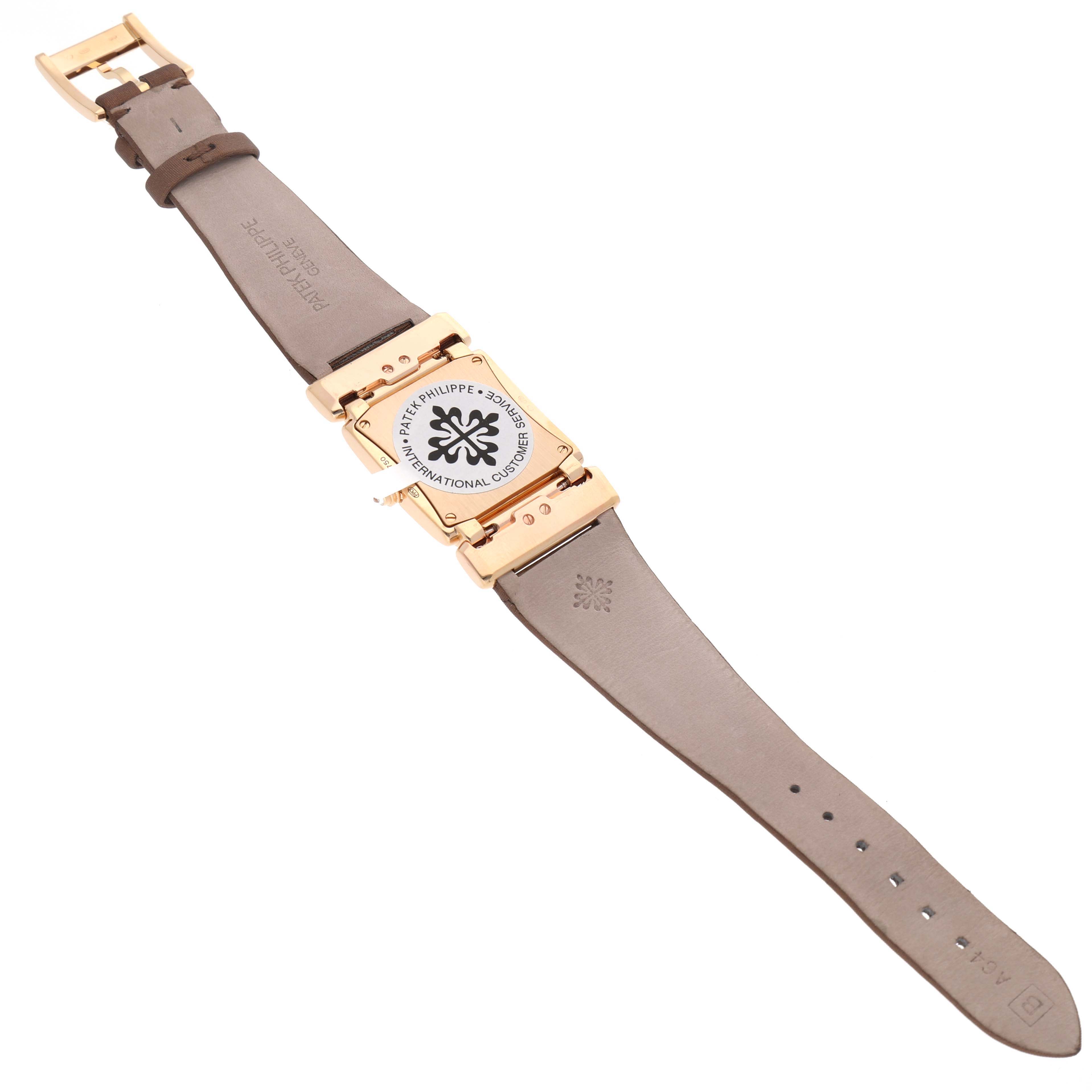 The image shows the underside of a Patek Philippe Twenty-4 4920R-001 Women's Rose Gold Brown Dial watch, displaying the strap and case back.