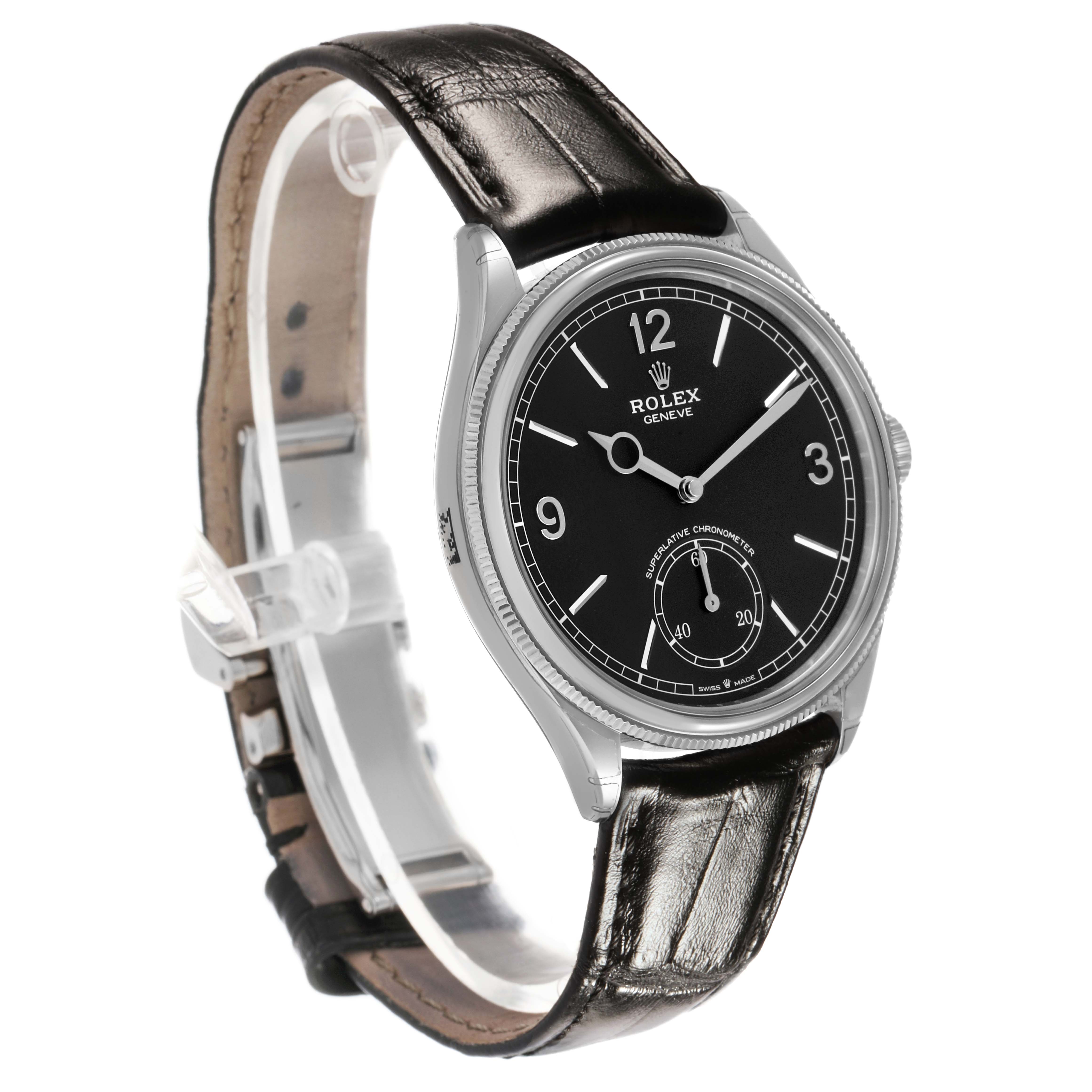 The Rolex 1908 52509 Men's White Gold Black Dial watch is shown from a 3/4 angle, displaying its black dial, silver case, and leather strap.
