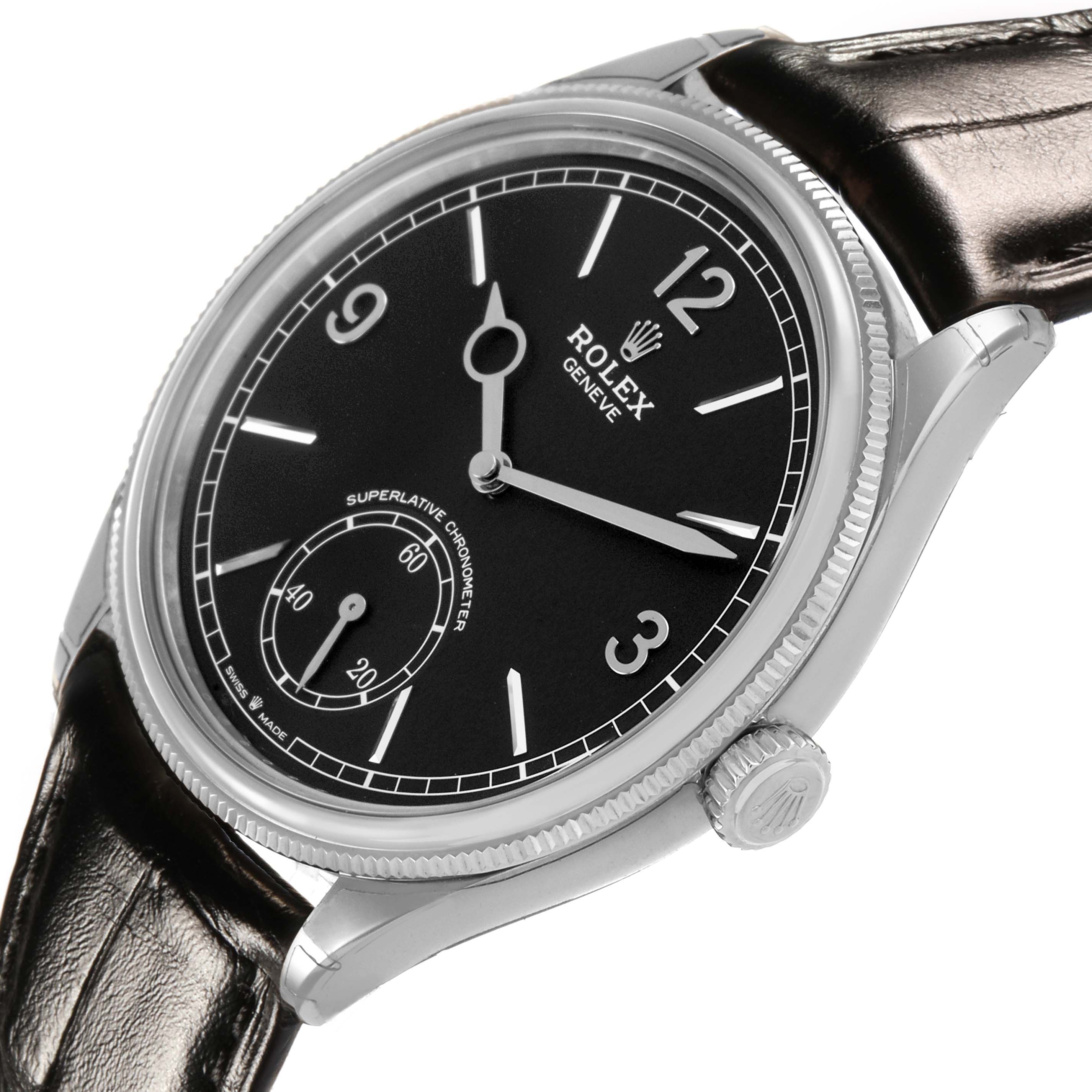 The Rolex 1908 52509 Men's White Gold Black Dial model is shown from a side-angle, highlighting the black dial, silver case, crown, and leather strap.