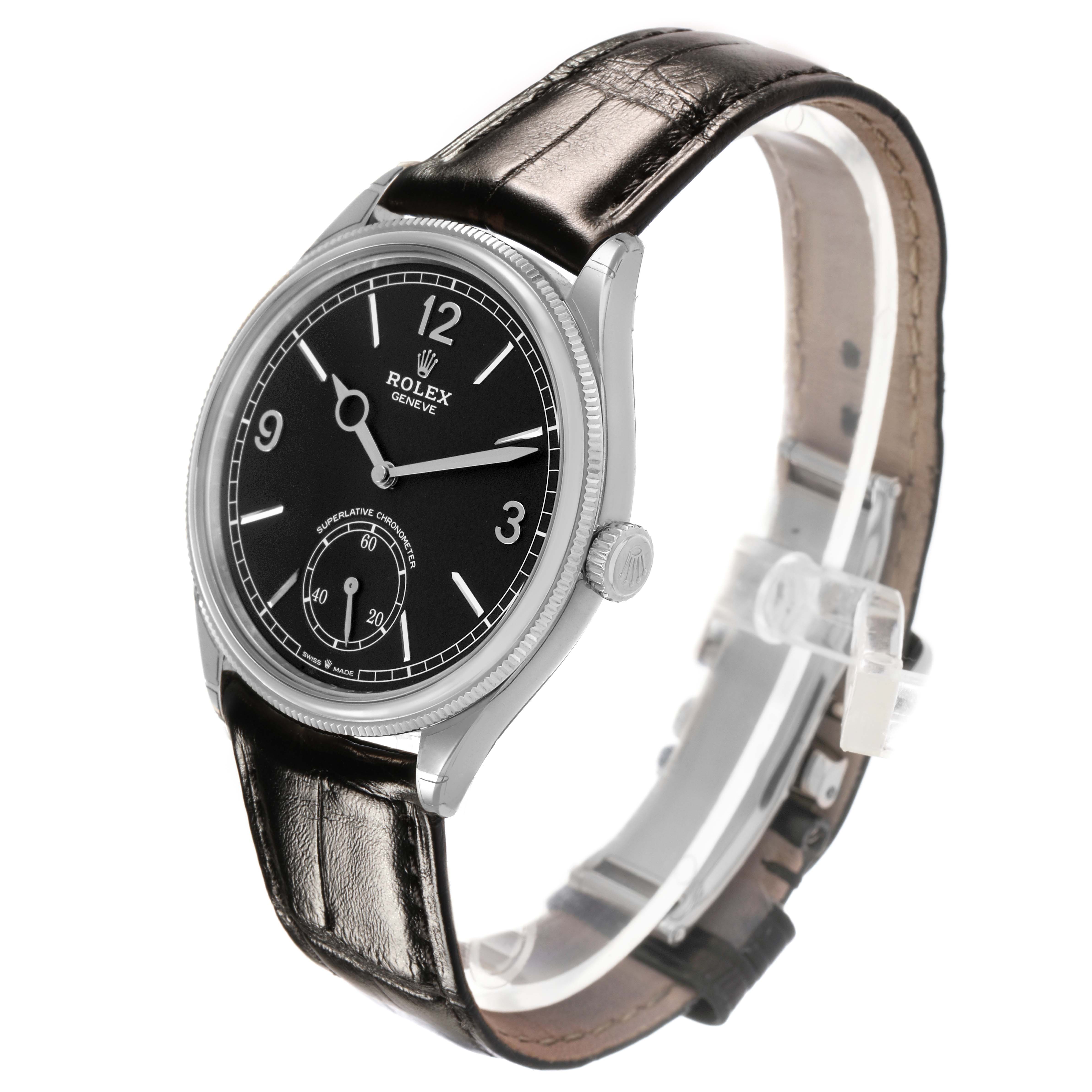 The Rolex 1908 52509 Men's White Gold Black Dial model is shown at a three-quarter angle, displaying its face, crown, and leather strap.