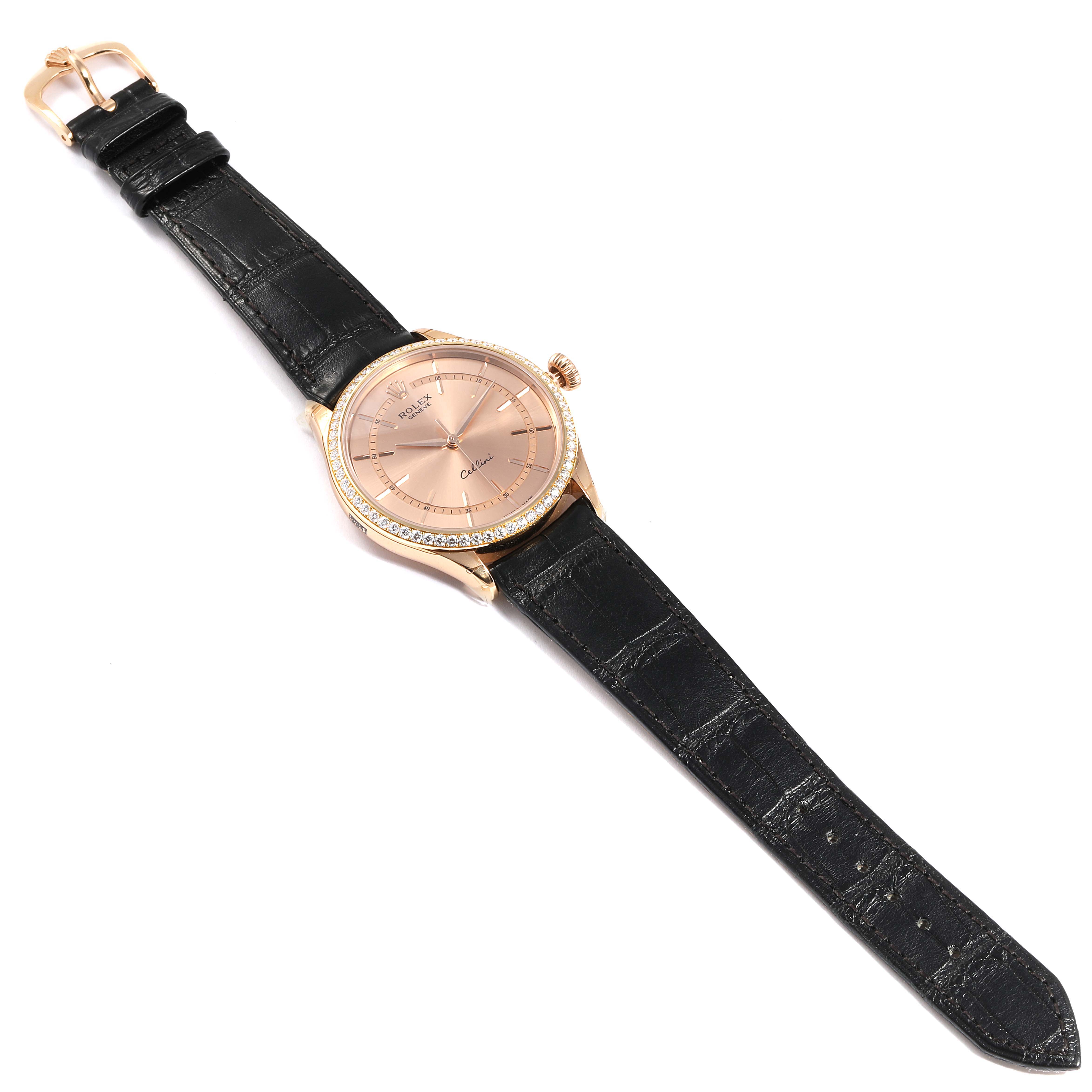 The image shows a Rolex Cellini 50705 Men
s Rose Gold Pink Dial 50705 Men
s Rose Gold Pink Dial watch, angled from the top, displaying the face, crown, and leather strap.