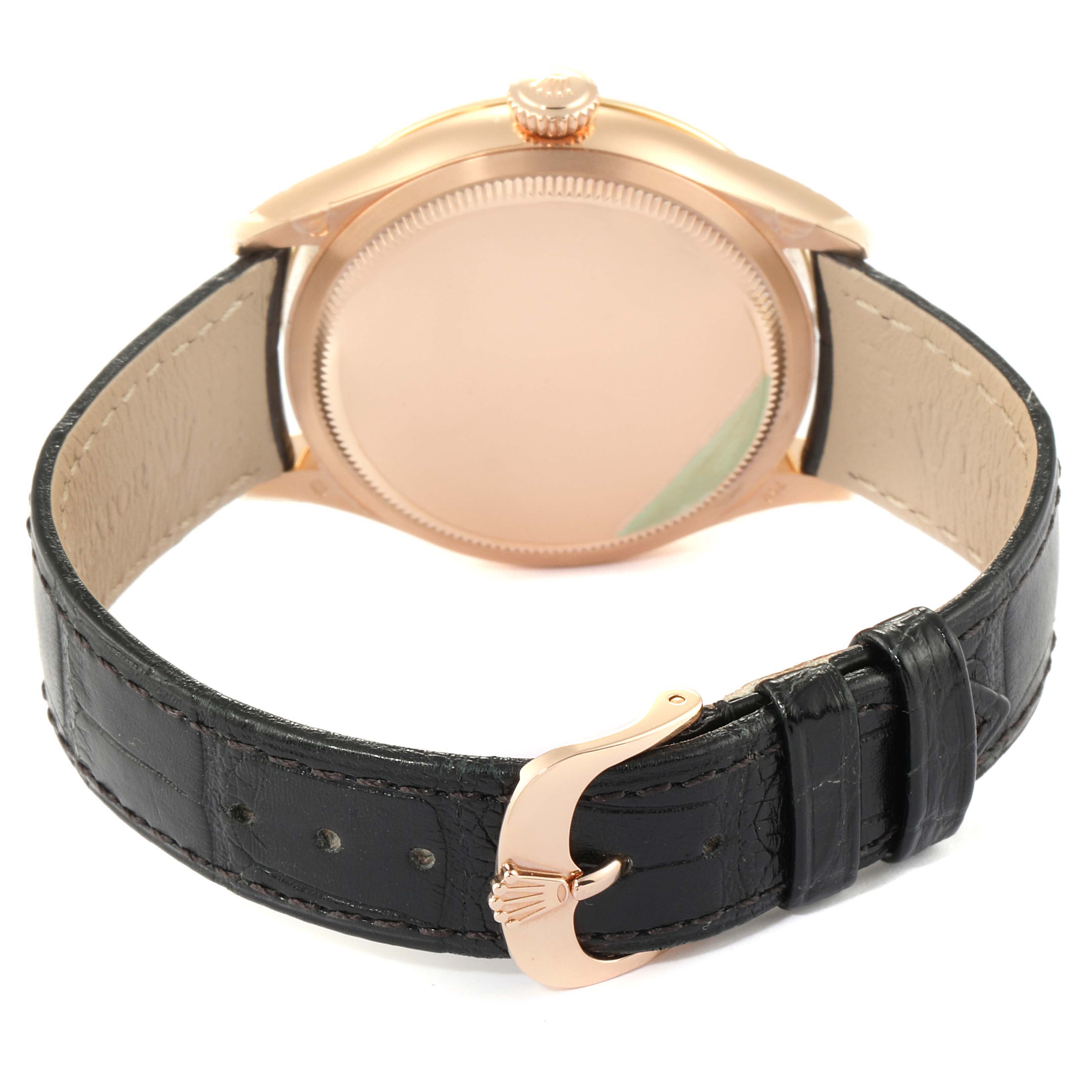 The image shows the back view of the Rolex Cellini 50705 Men
s Rose Gold Pink Dial 50705 Men
s Rose Gold Pink Dial watch, highlighting its case, crown, and black leather strap.