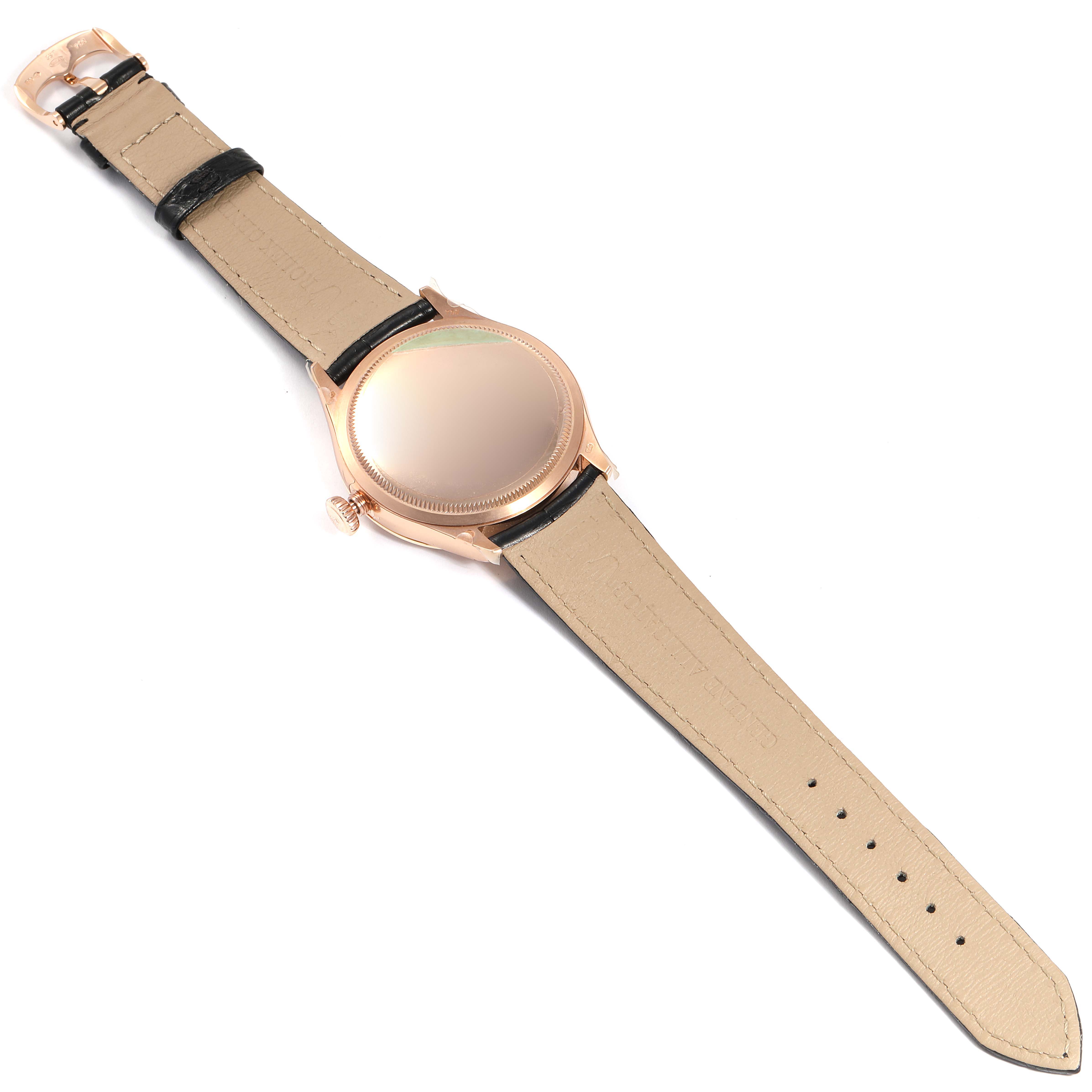 The image shows the back view of a Rolex Cellini 50705 Men
s Rose Gold Pink Dial 50705 Men
s Rose Gold Pink Dial watch with its leather strap fully extended.