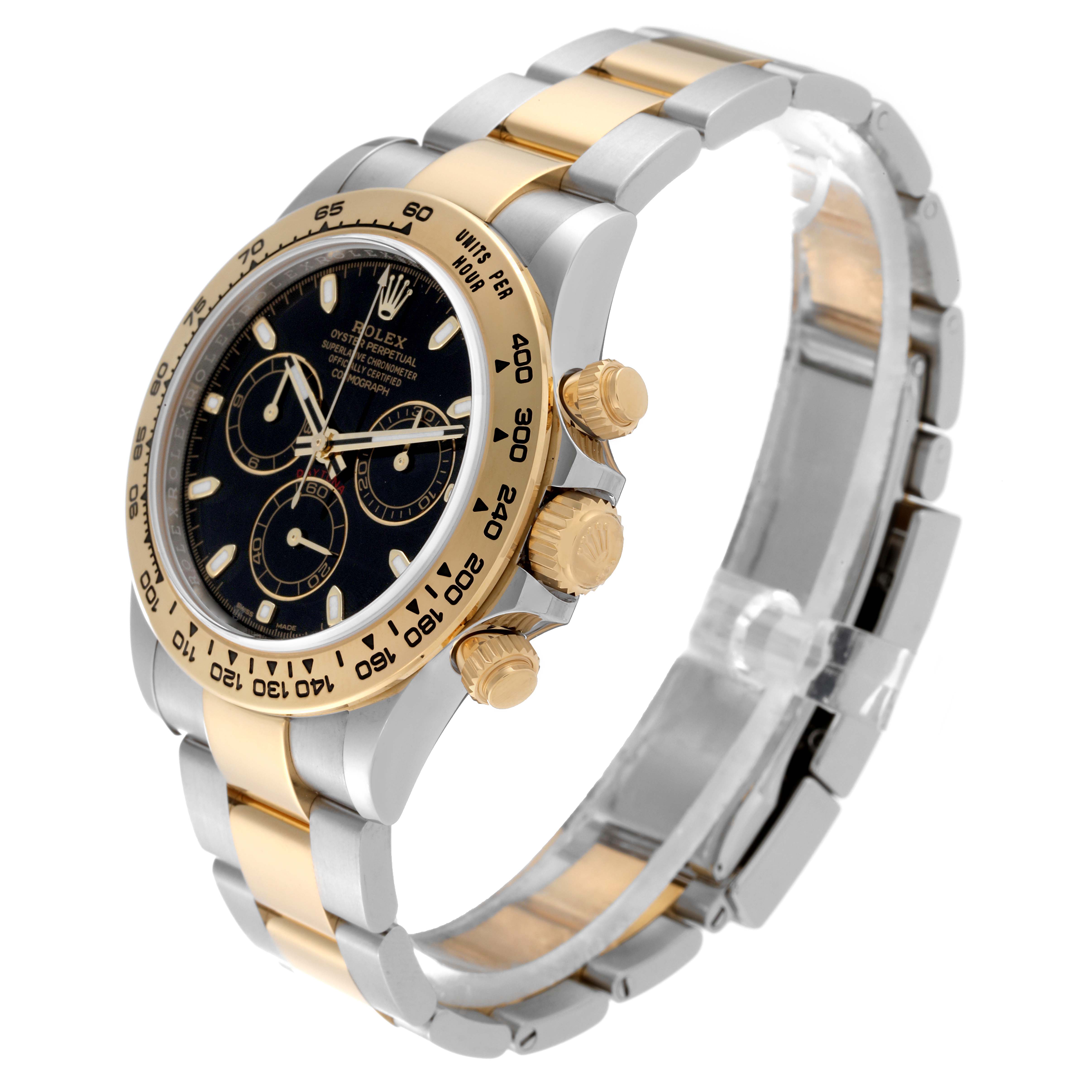 This image shows a Rolex Daytona 116503 Men's Steel and Gold (two tone) Black Dial 116503 Men's Steel and Gold (two tone) Black Dial watch at an oblique angle, highlighting the black dial, gold bezel, and two-tone metal bracelet.