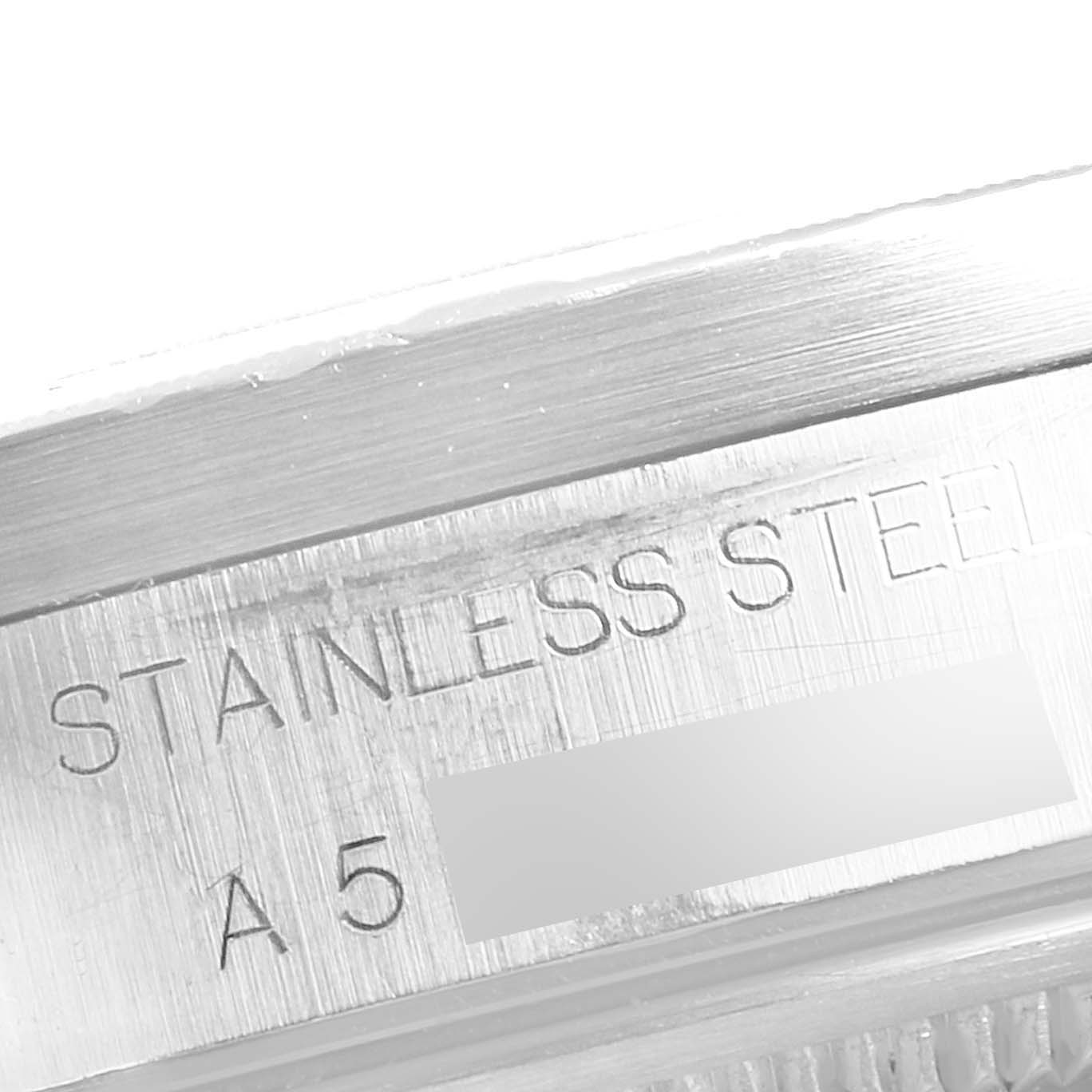 This image shows a close-up of the stainless steel casing with engravings on a Rolex Date 15210 Men's Stainless Steel Black Dial 15210 Men's Stainless Steel Black Dial model watch.