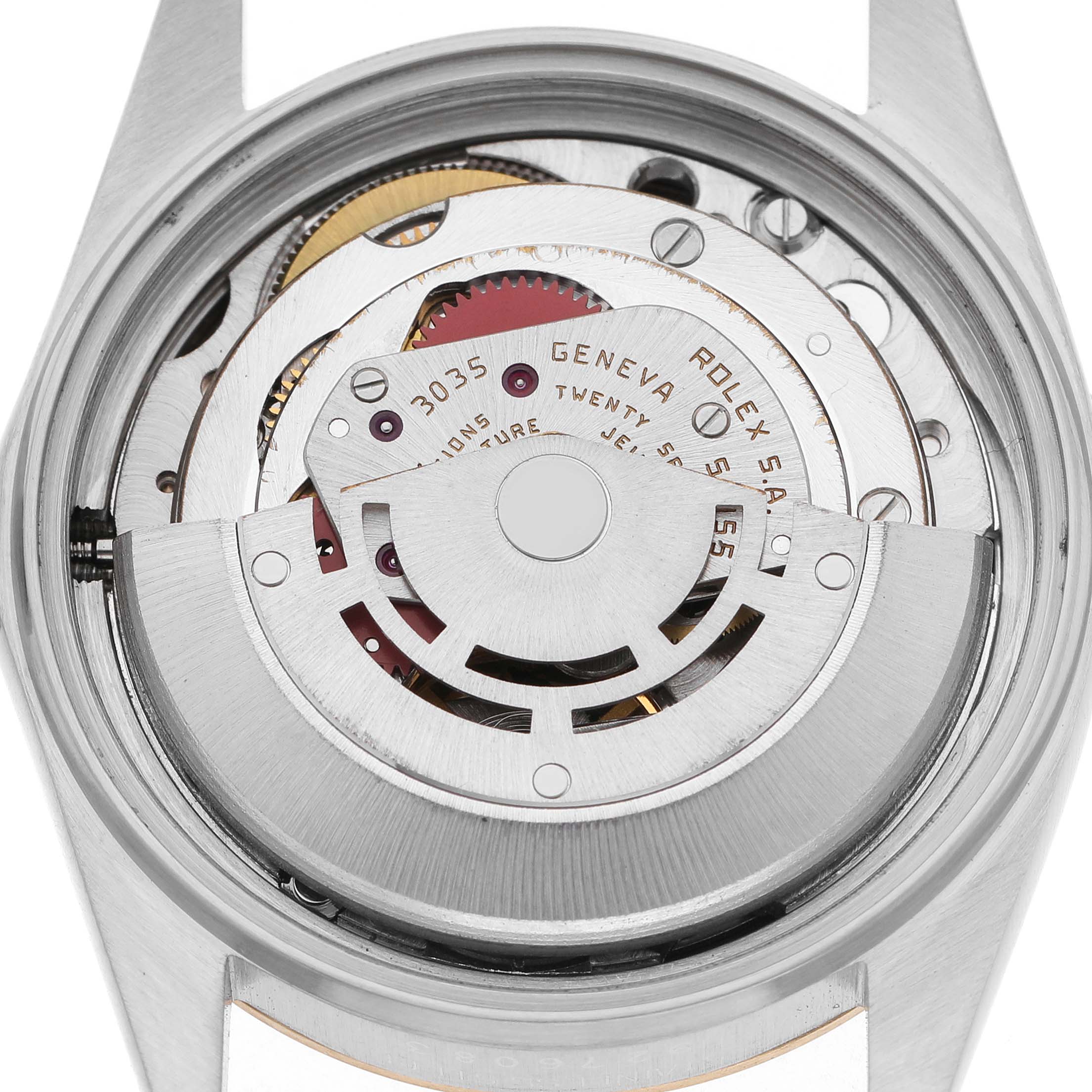 The image shows the movement of a Rolex Datejust 16013 Men's Steel and Gold (two tone) Champagne Dial viewed from the back, highlighting the rotor and other internal components.