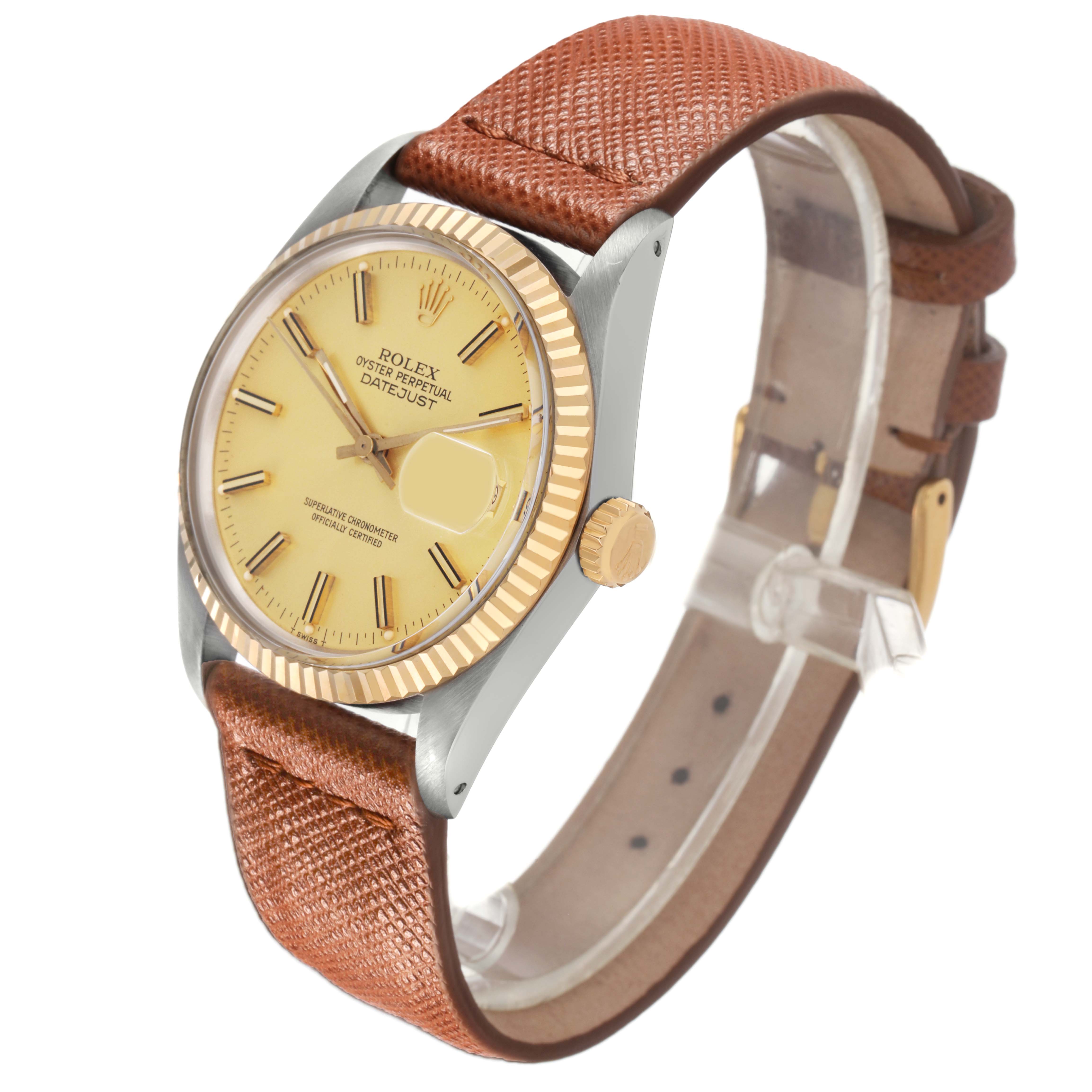 The Rolex Datejust 16013 Men's Steel and Gold (two tone) Champagne Dial watch is shown at a three-quarter angle, highlighting its dial, bezel, crown, and leather strap.