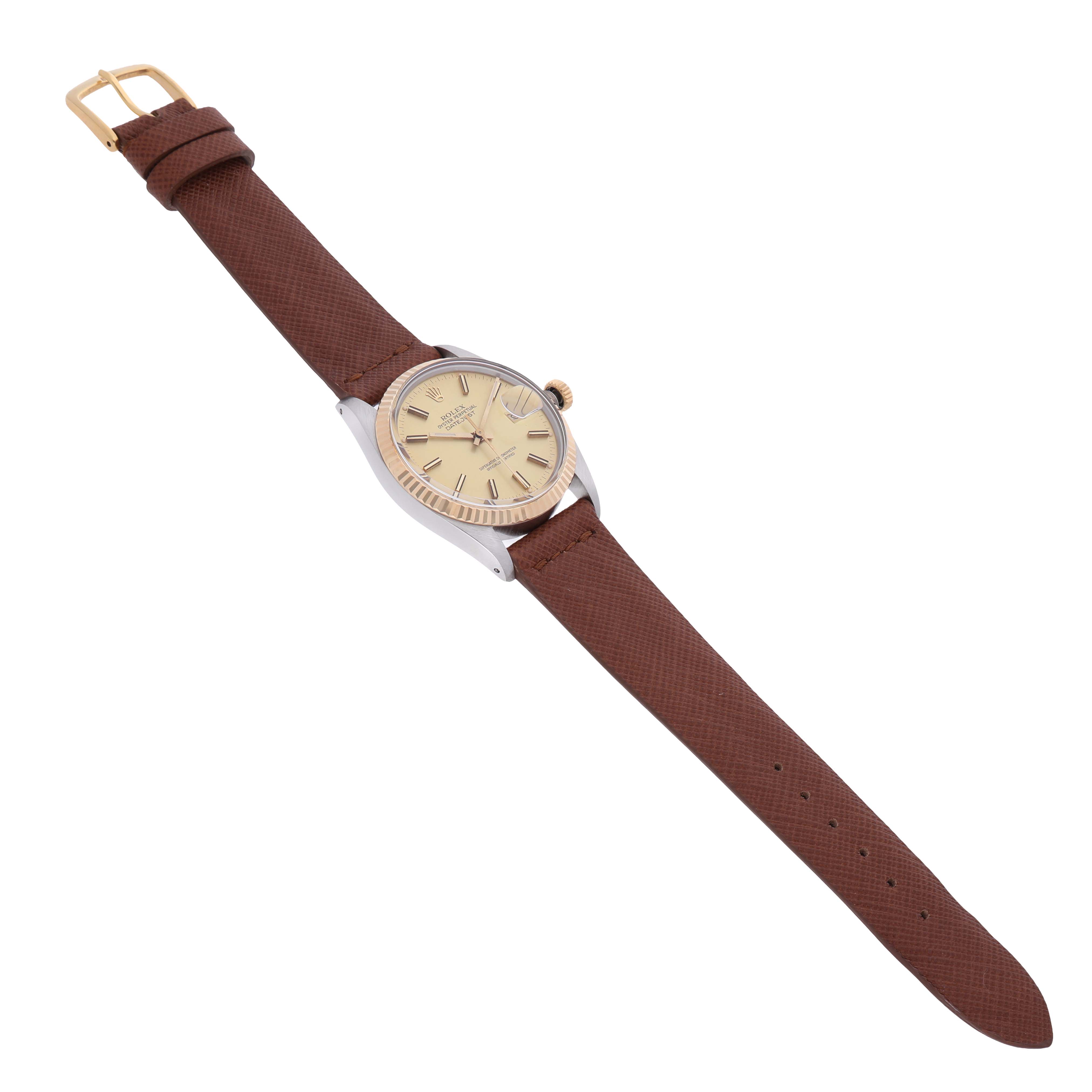 The Rolex Datejust 16013 Men's Steel and Gold (two tone) Champagne Dial watch is shown at a slight angle, displaying its full face and brown leather strap.