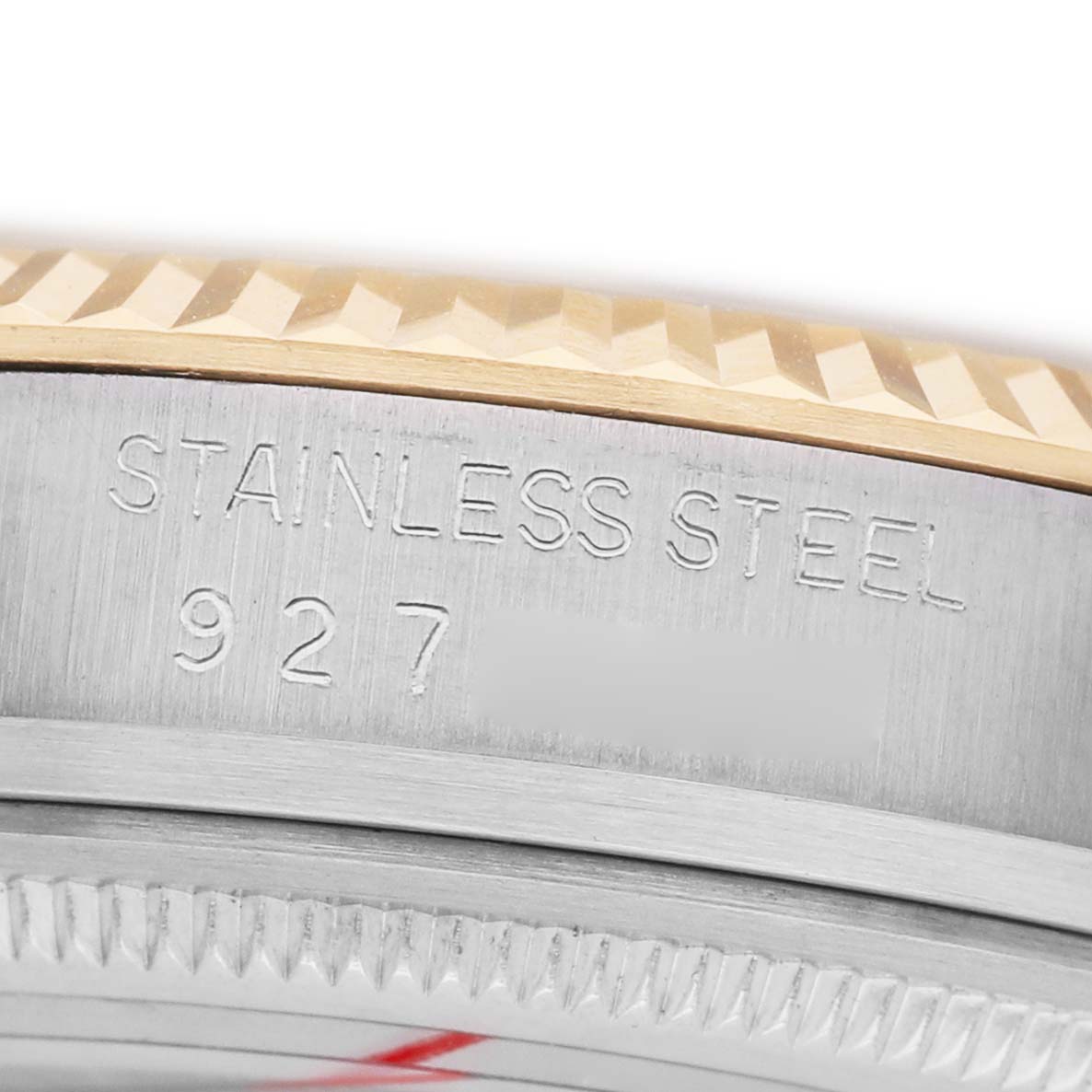 The image shows a close-up side view of a Rolex Datejust 16013 Men's Steel and Gold (two tone) Champagne Dial bezel and part of the case, highlighting the "Stainless Steel" engraving.