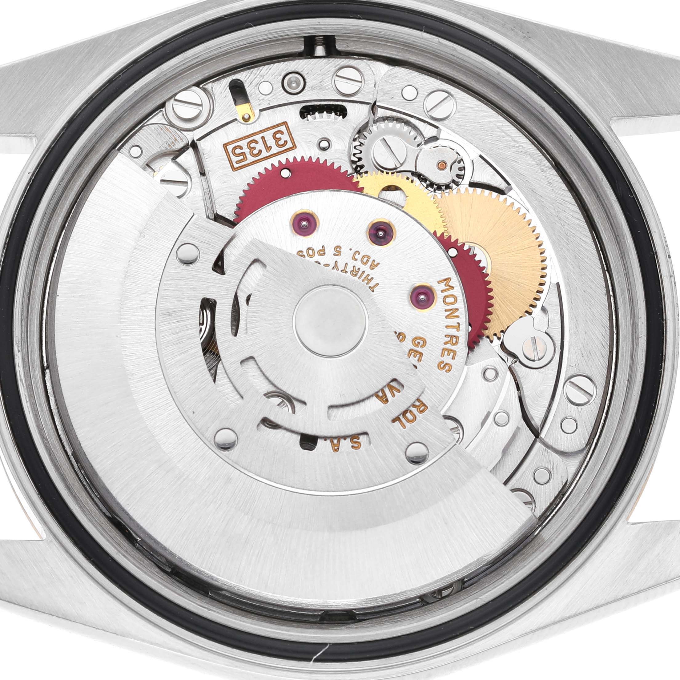 The image shows the movement of a Rolex Datejust 16233 Men's Stainless Steel Grey Dial watch from a back angle, highlighting gears and mechanisms.