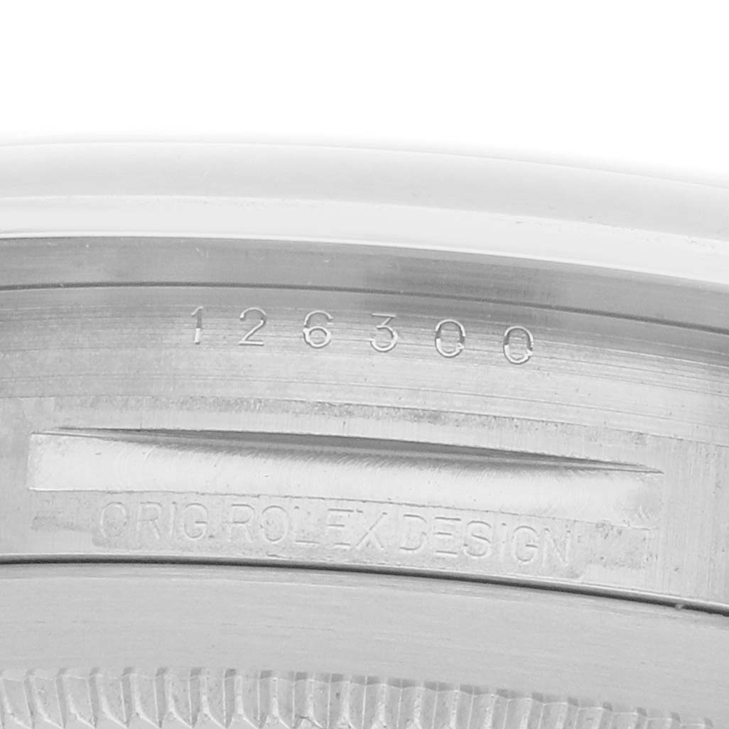 The image shows the engraved model number and "ORIG. ROLEX DESIGN" on the inner bezel of a Rolex Datejust 41 126300 Men
s Stainless Steel Grey Dial.