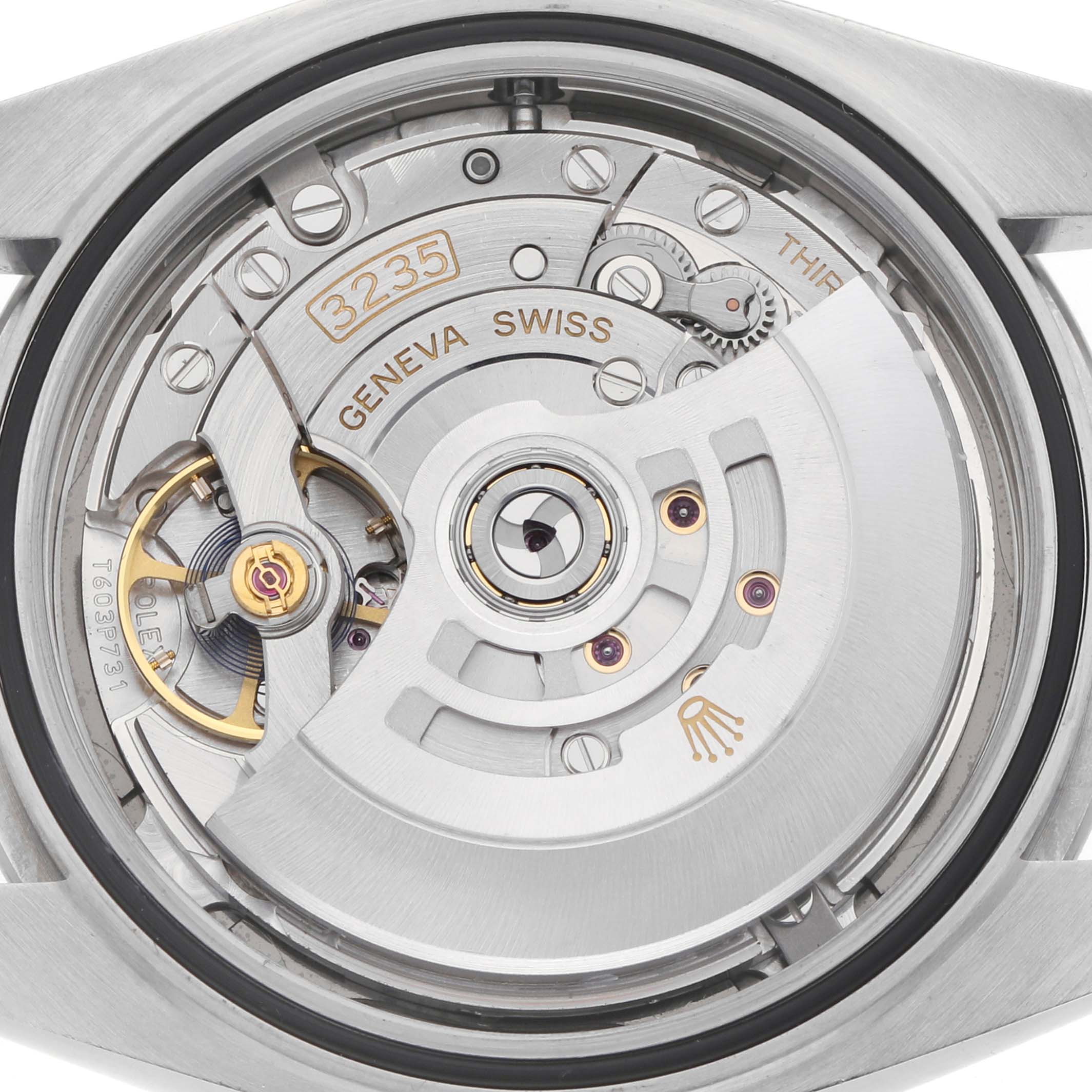 The image shows the back view of a Rolex Datejust 41 126300 Men
s Stainless Steel Grey Dial, revealing its intricate movement and mechanism components.