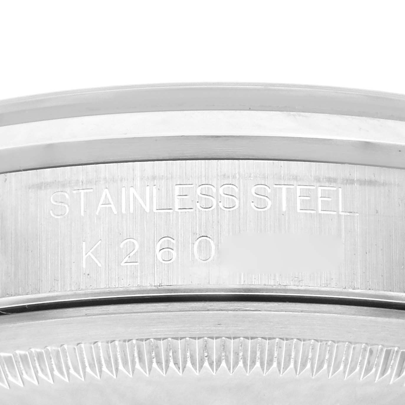This image shows a close-up of the stainless steel engraving and case edge of a Rolex Datejust 16200 Men's Stainless Steel Blue Dial 16200 Men's Stainless Steel Blue Dial watch.