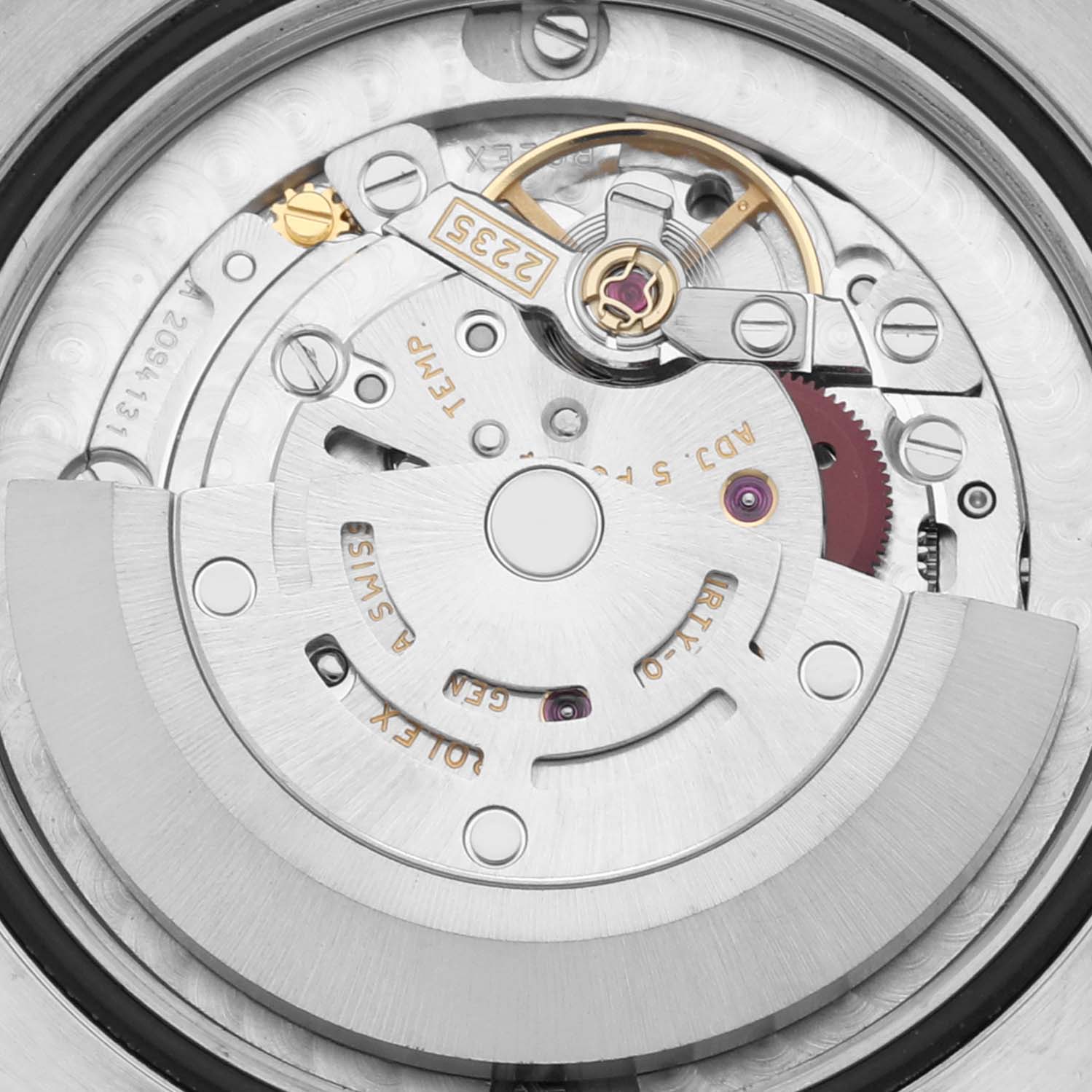 This image shows a close-up view of the intricate internal mechanism of a Mid-Size Rolex watch, including the rotor and gears.