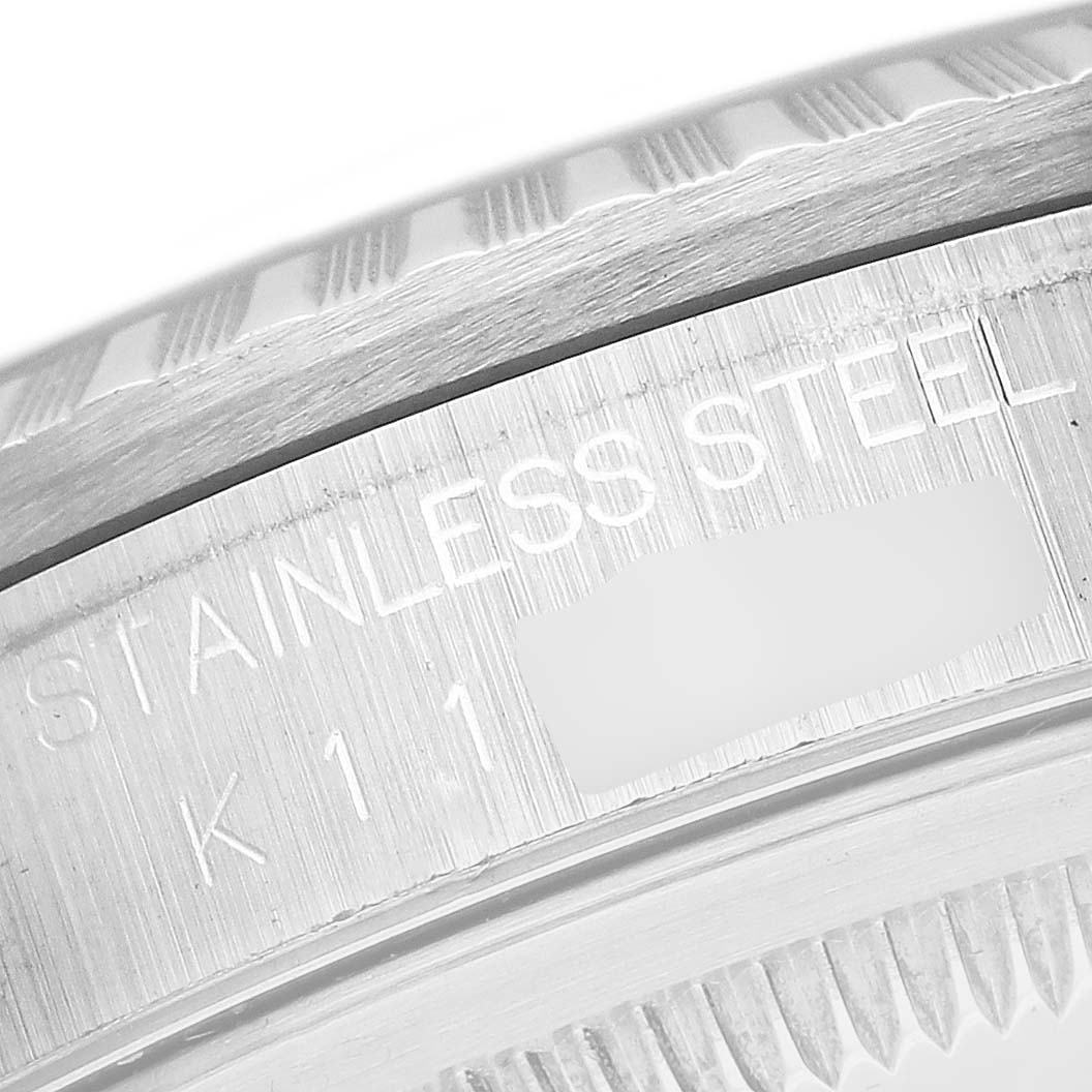 The image shows a close-up of the stainless steel engraving on the side of a Rolex Datejust 16220 Men's Stainless Steel Silver Dial 16220 Men's Stainless Steel Silver Dial watch case.
