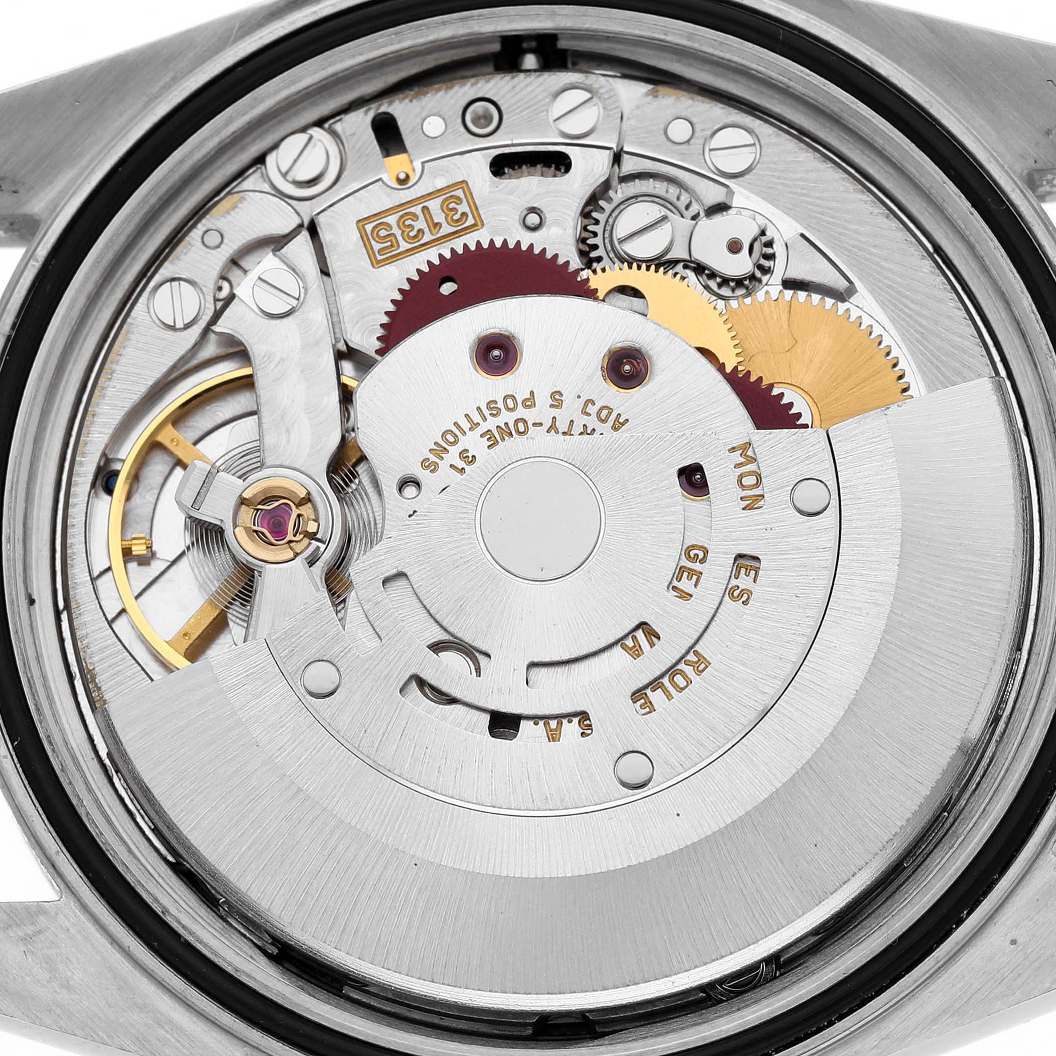 This image shows the internal mechanical movement of the Rolex Datejust 16220 Men's Stainless Steel Silver Dial 16220 Men's Stainless Steel Silver Dial watch, highlighting its intricate gears and components.