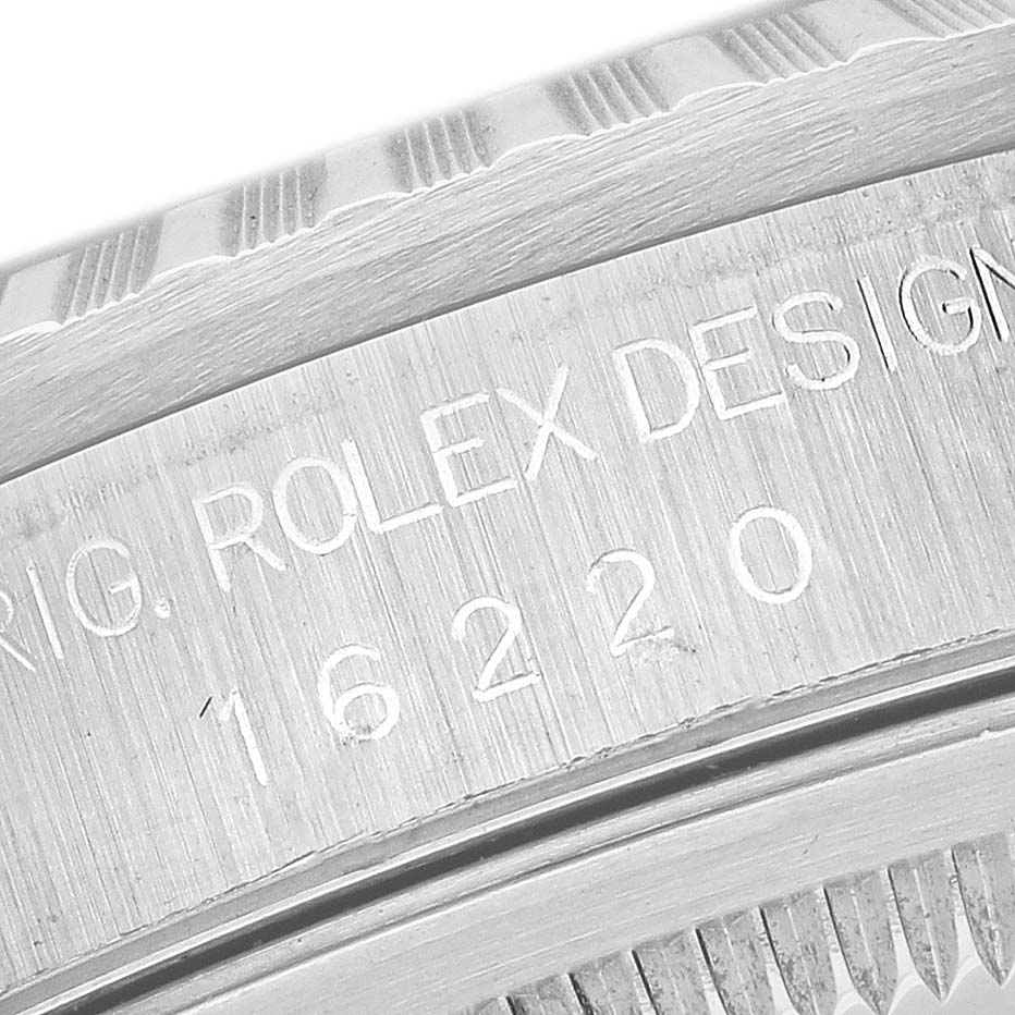 This close-up image shows part of the bezel and the engraved design number (16220) of the Rolex Datejust 16220 Men's Stainless Steel Silver Dial 16220 Men's Stainless Steel Silver Dial watch.