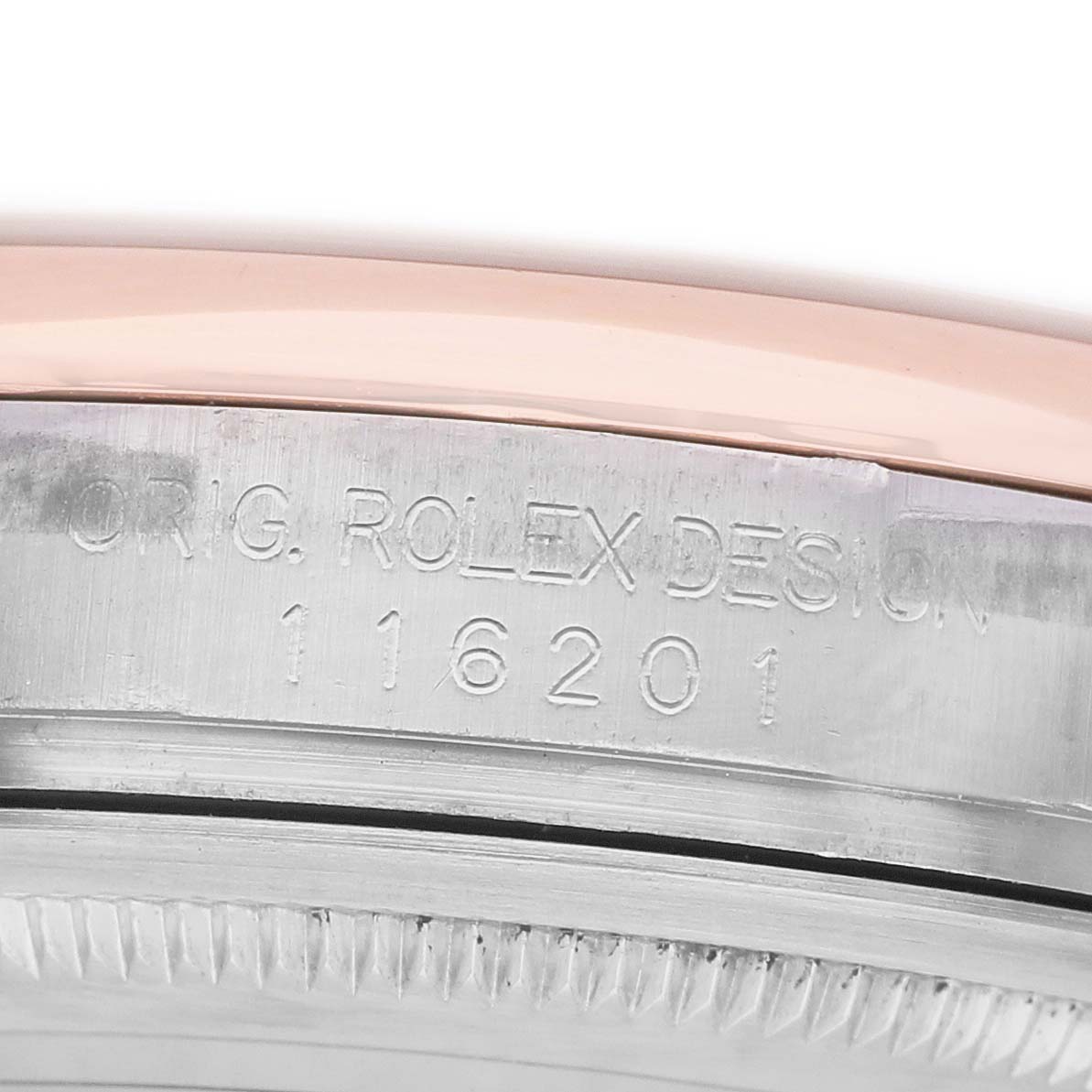 The image shows a close-up of the side view of a Rolex Datejust 116201 Women's Stainless Steel Pink Dial, highlighting the bezel and case engraving.