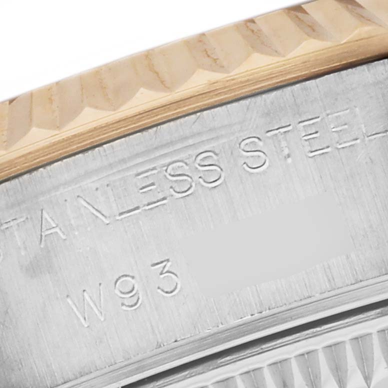This image shows a close-up of the rim and text engraving on the bezel of a Rolex Datejust 69173 Women's Steel and Gold (two tone) Silver Dial 69173 Women's Steel and Gold (two tone) Silver Dial watch.