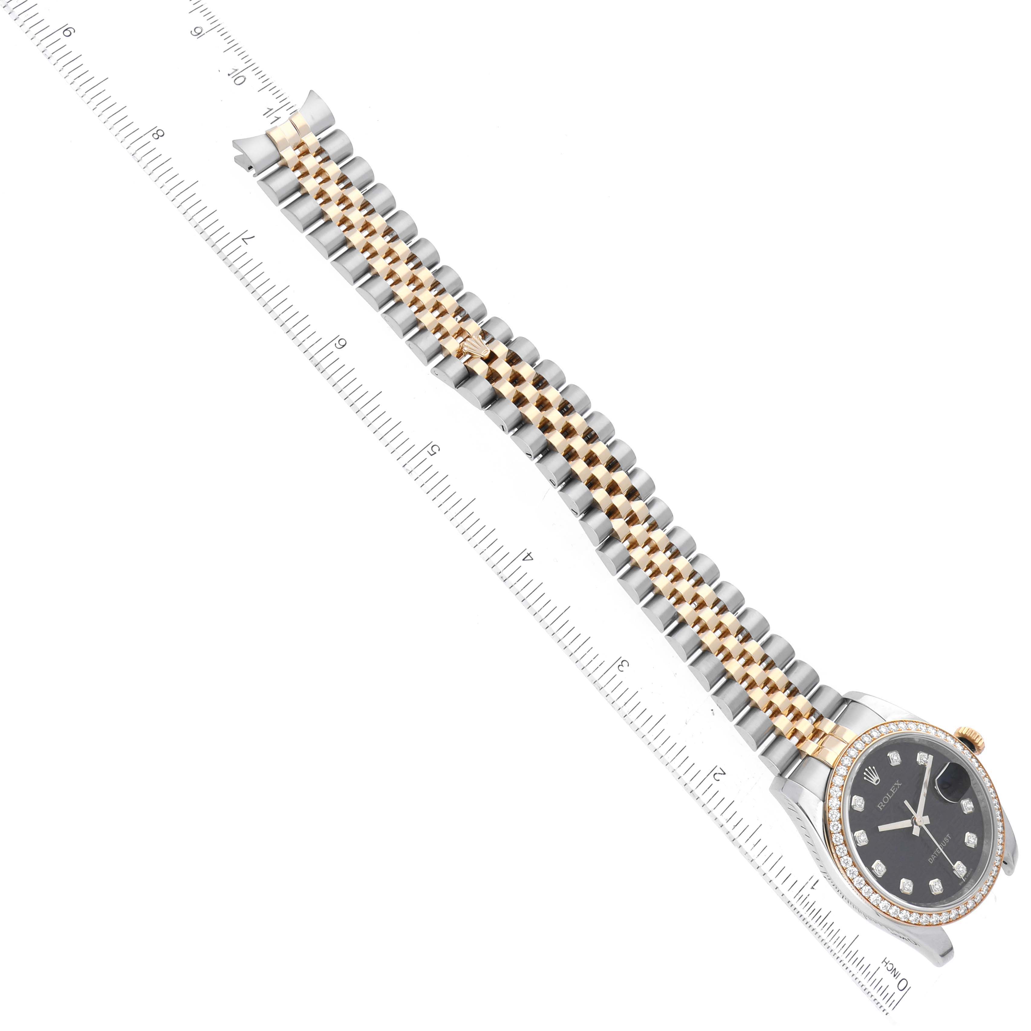 The Rolex Datejust 116243 Men's Steel and Gold (two tone) Black Dial 116243 Men's Steel and Gold (two tone) Black Dial watch is shown at an angle, displaying the full bracelet, two-tone band, and diamond-set black dial.