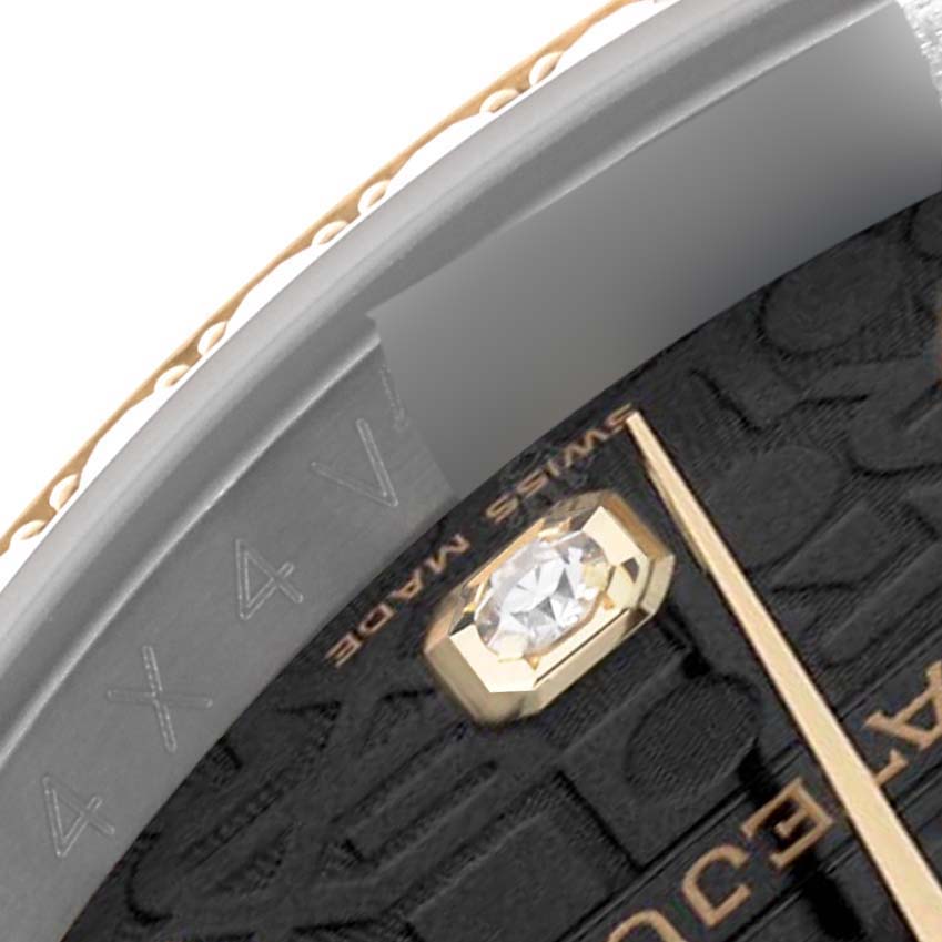 The image shows a close-up of the bezel, half dial, and a diamond hour marker of a Rolex Datejust 116243 Men's Steel and Gold (two tone) Black Dial 116243 Men's Steel and Gold (two tone) Black Dial watch.